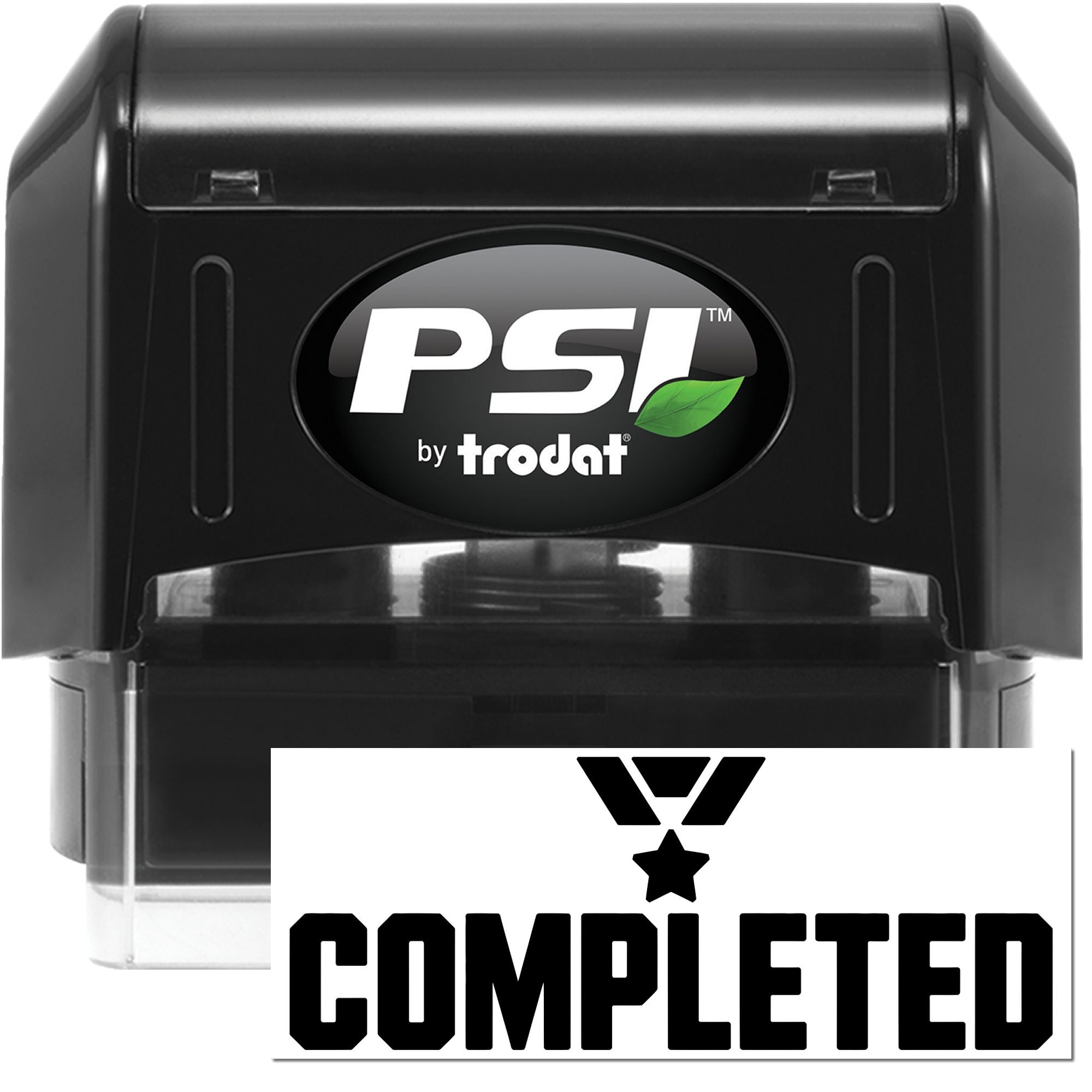 Black PSI by Trodat self-inking stamp, black casing with green leaf logo, and bold COMPLETED seal impression.
