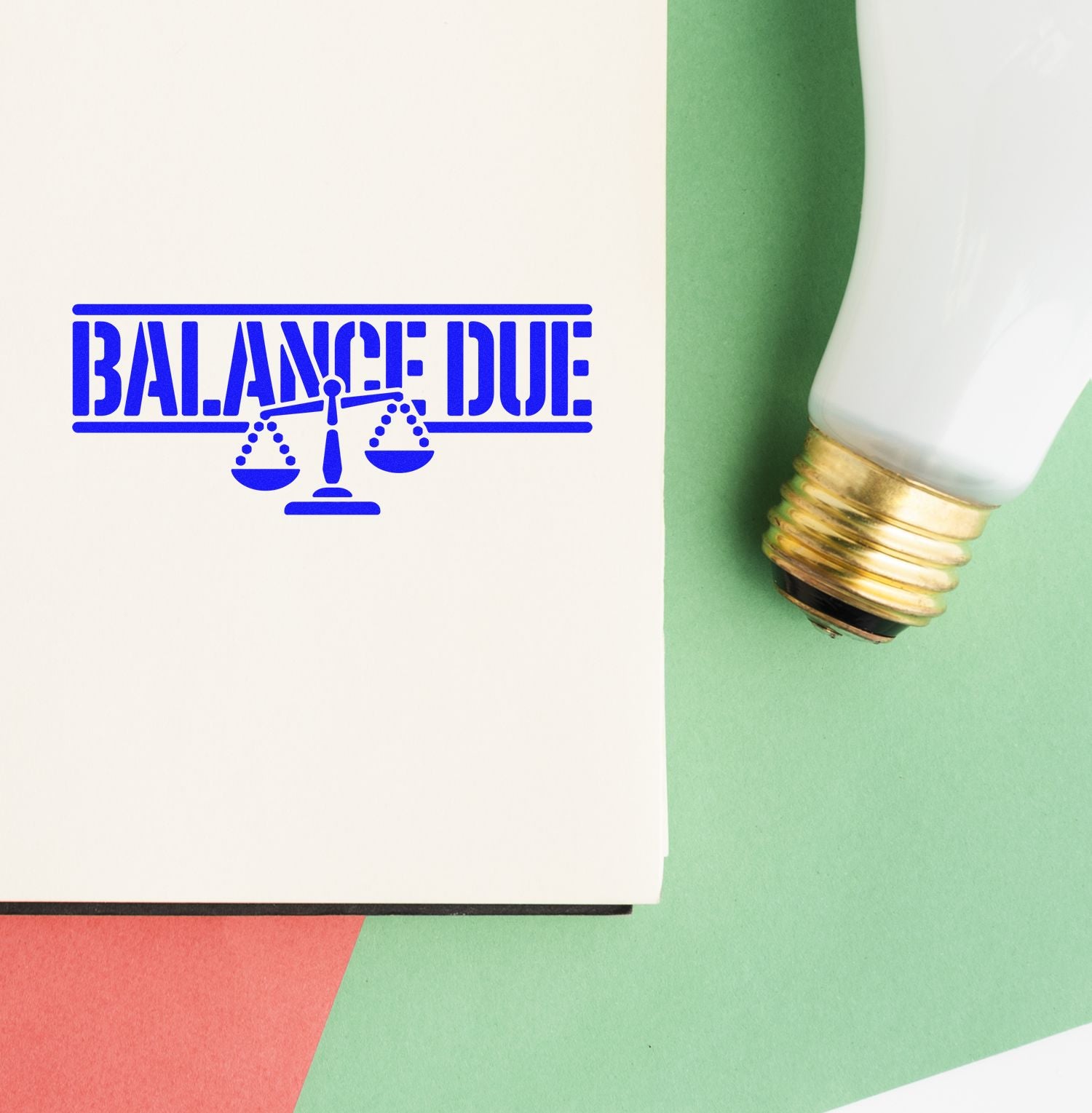 Blue balance due stamp and white-gold seal applicator on green paper background.