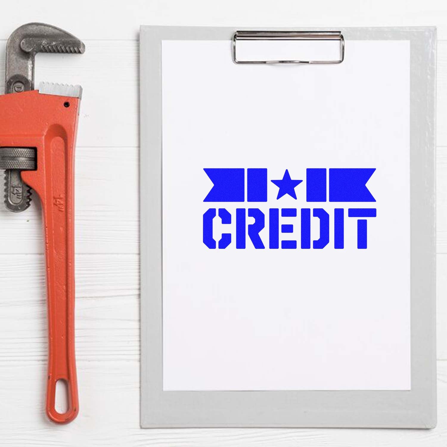 Blue HI CREDIT stamp and seal logo on a white clipboard beside a red pipe wrench.