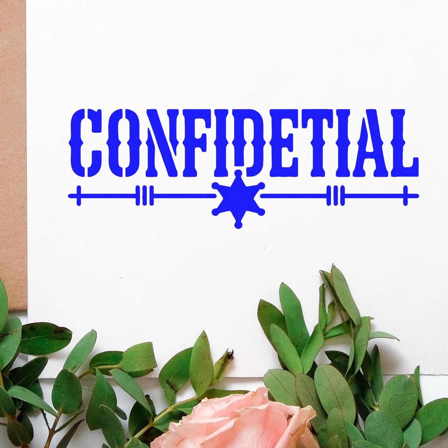 Blue CONFIDENTIAL stamp and seal with sheriff-style star on white paper, framed by green leaves and pink rose.