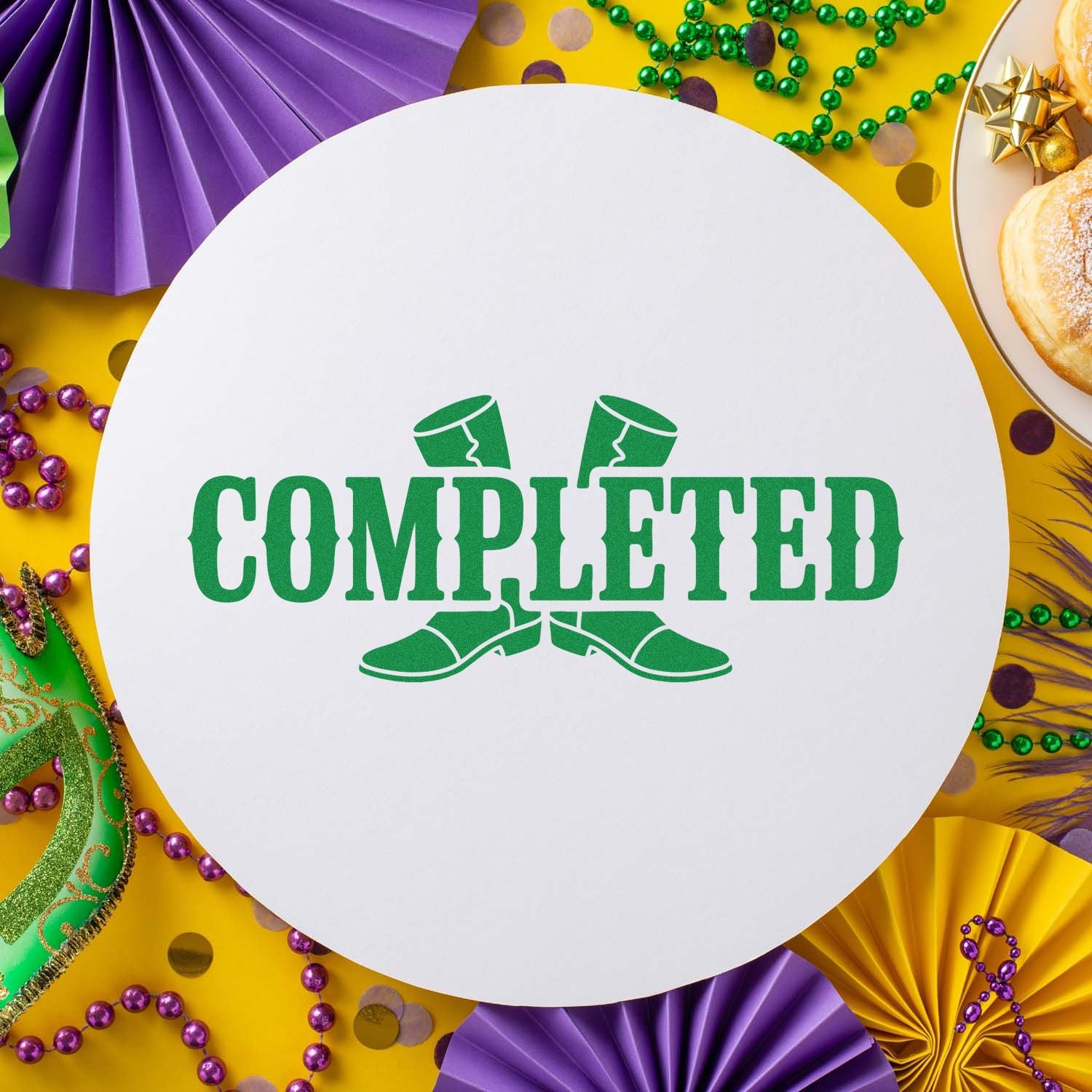 Green COMPLETED stamp and seal on white circle, with purple, gold and green Mardi Gras decorations.