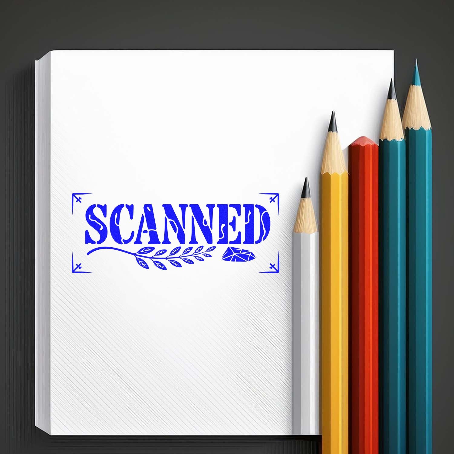 White notebook with blue SCANNED stamp and seal, beside yellow, red, teal and white pencils.