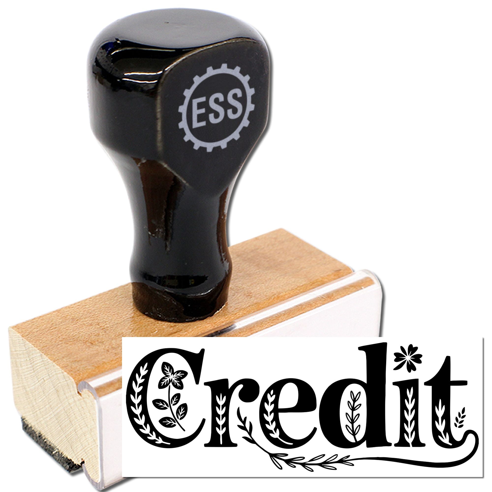 Black rubber stamp on light wood base with decorative Credit text and floral accents.