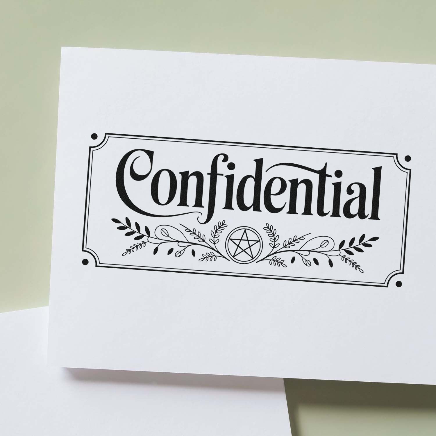 Black Confidential stamp and seal design with decorative border, botanical flourishes, and pentagram on white paper.