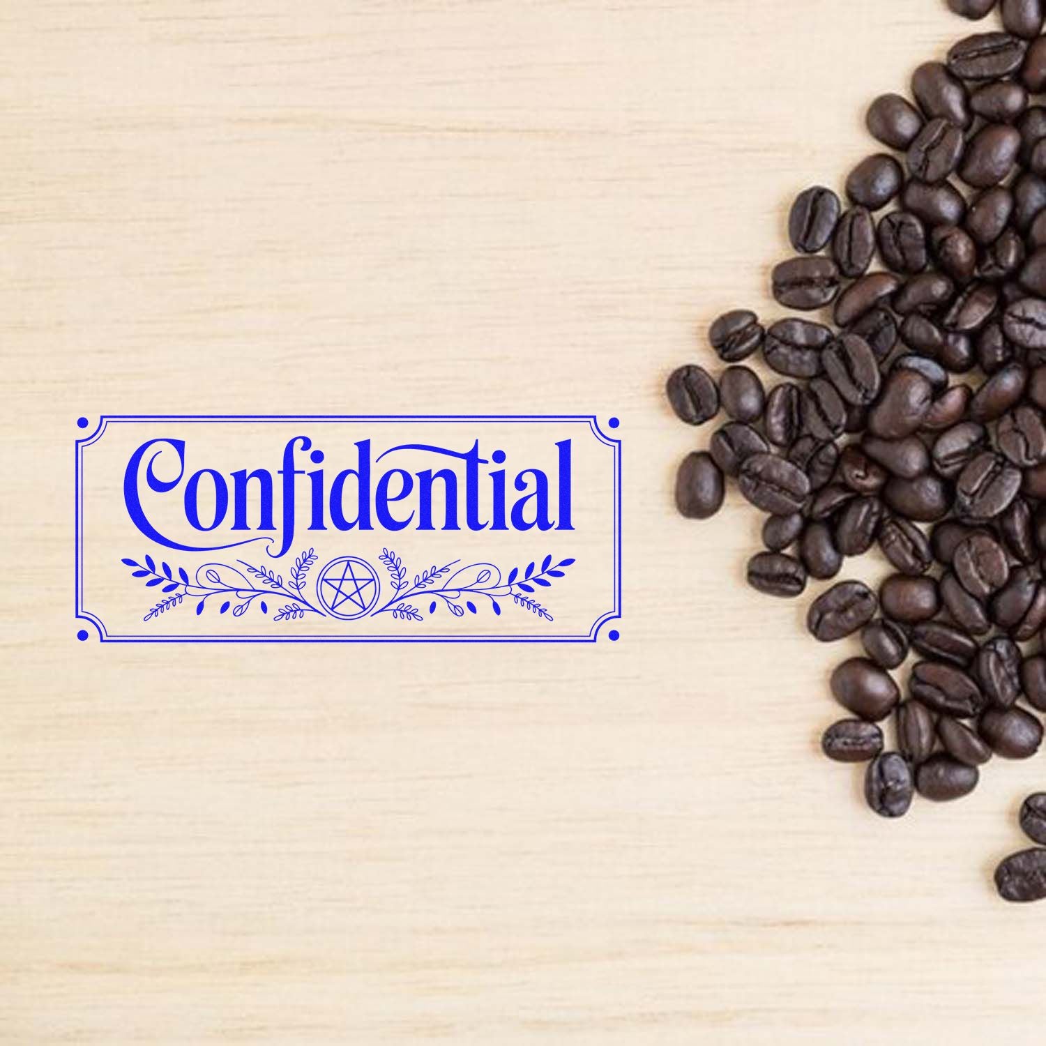 Blue Confidential stamp seal on light wood background beside dark coffee beans.