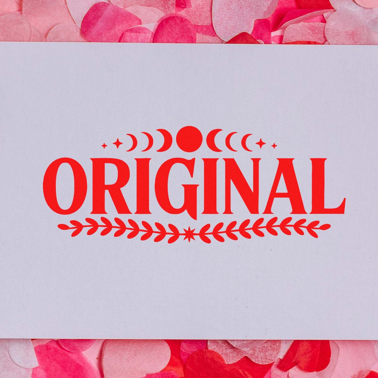 Red ORIGINAL stamp seal with crescent and leaf accents on a white card, set against a pink petal background.