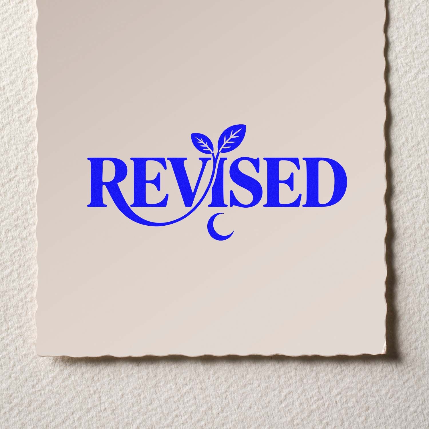 Blue REVISED stamp and seal with leaf sprout and crescent moon on beige textured paper