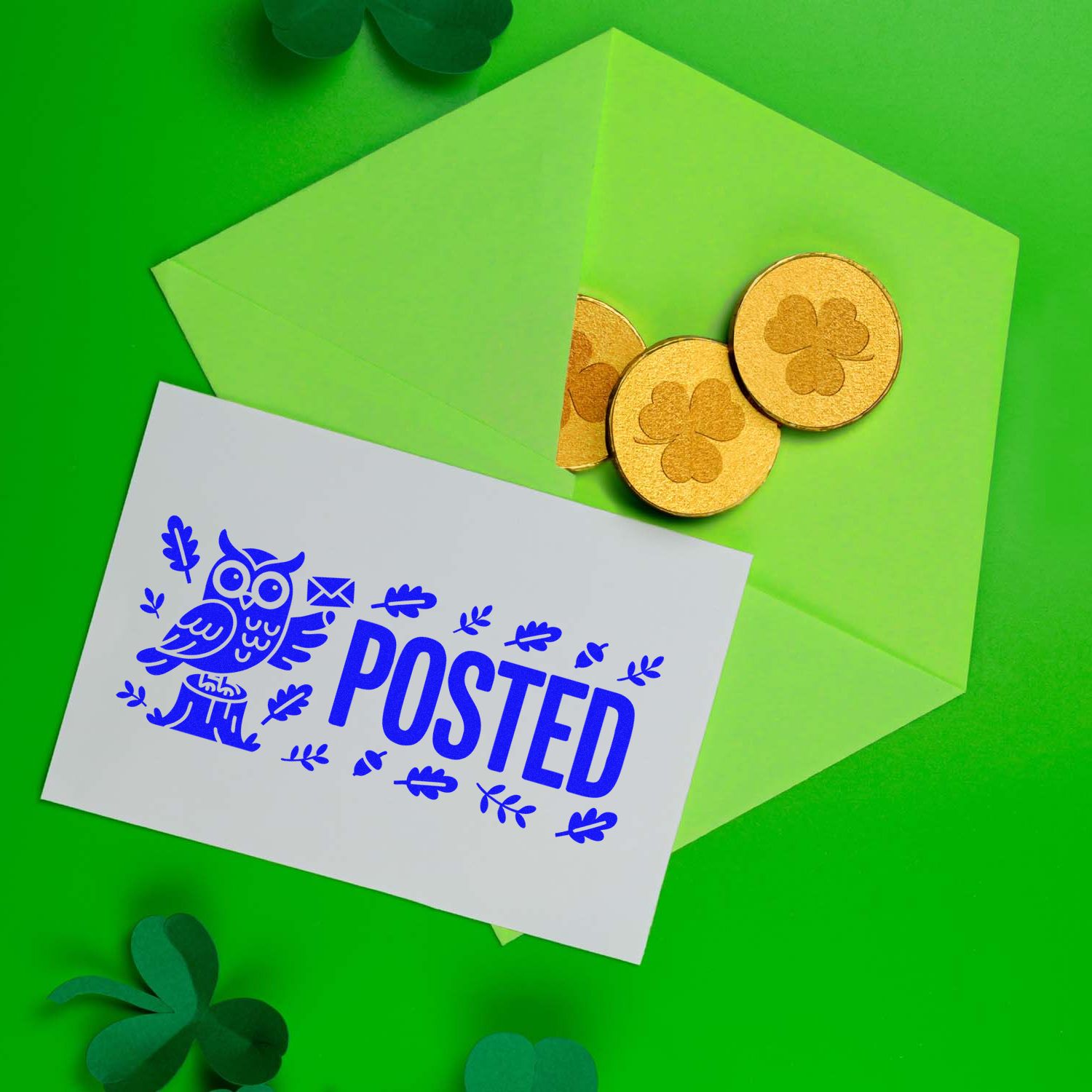 Green envelopes with gold shamrock seal stamps and a blue POSTED postal stamp card.