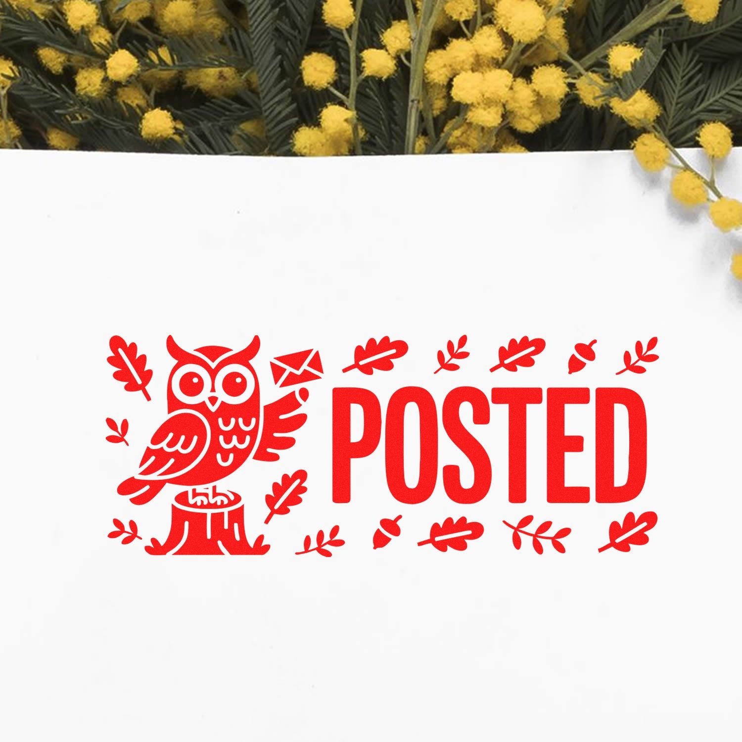 Red posted stamp and seal with owl, envelope, and leaves on white paper, framed by yellow flowers and green foliage.