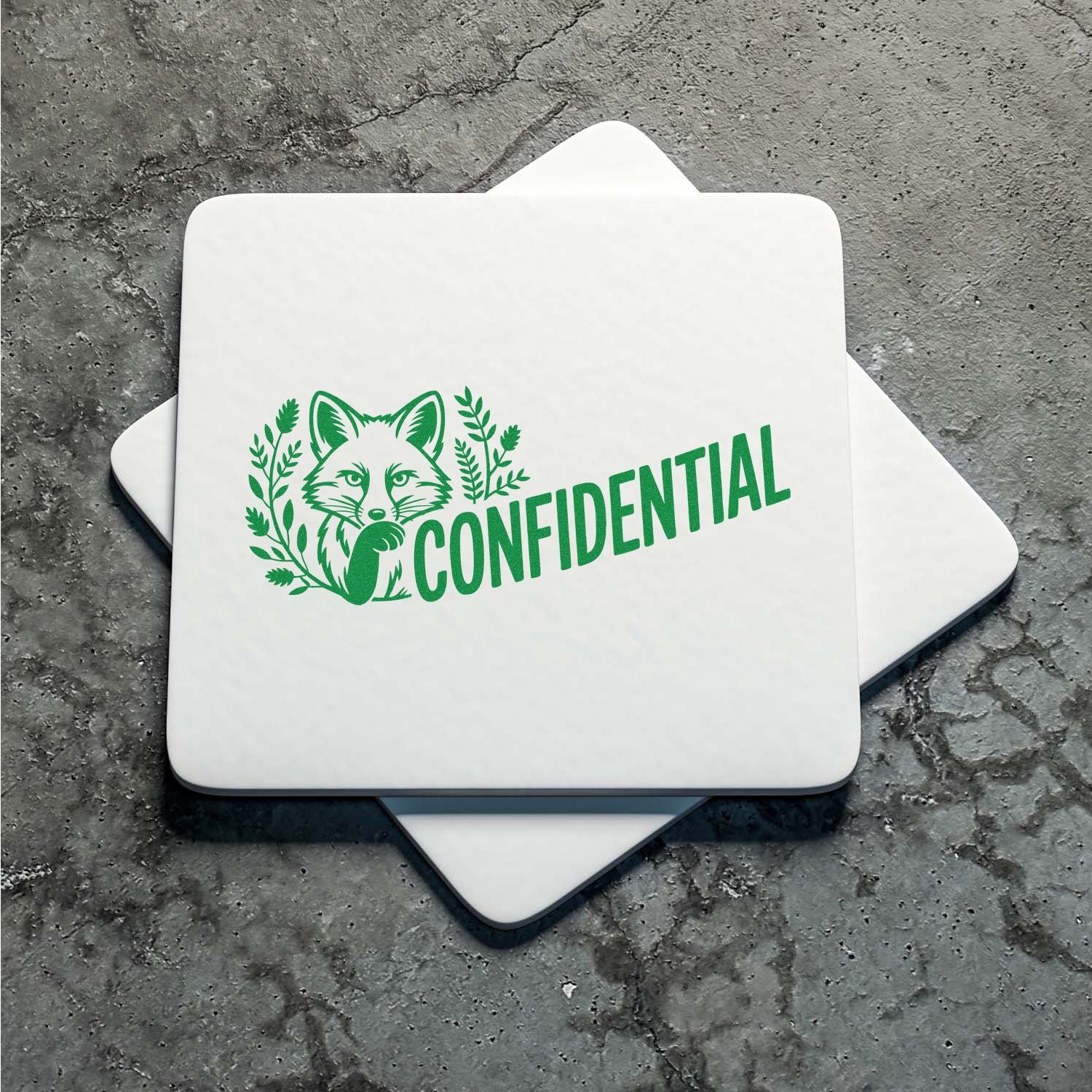 White stamp-and-seal plaques with green fox CONFIDENTIAL logo on a gray textured surface