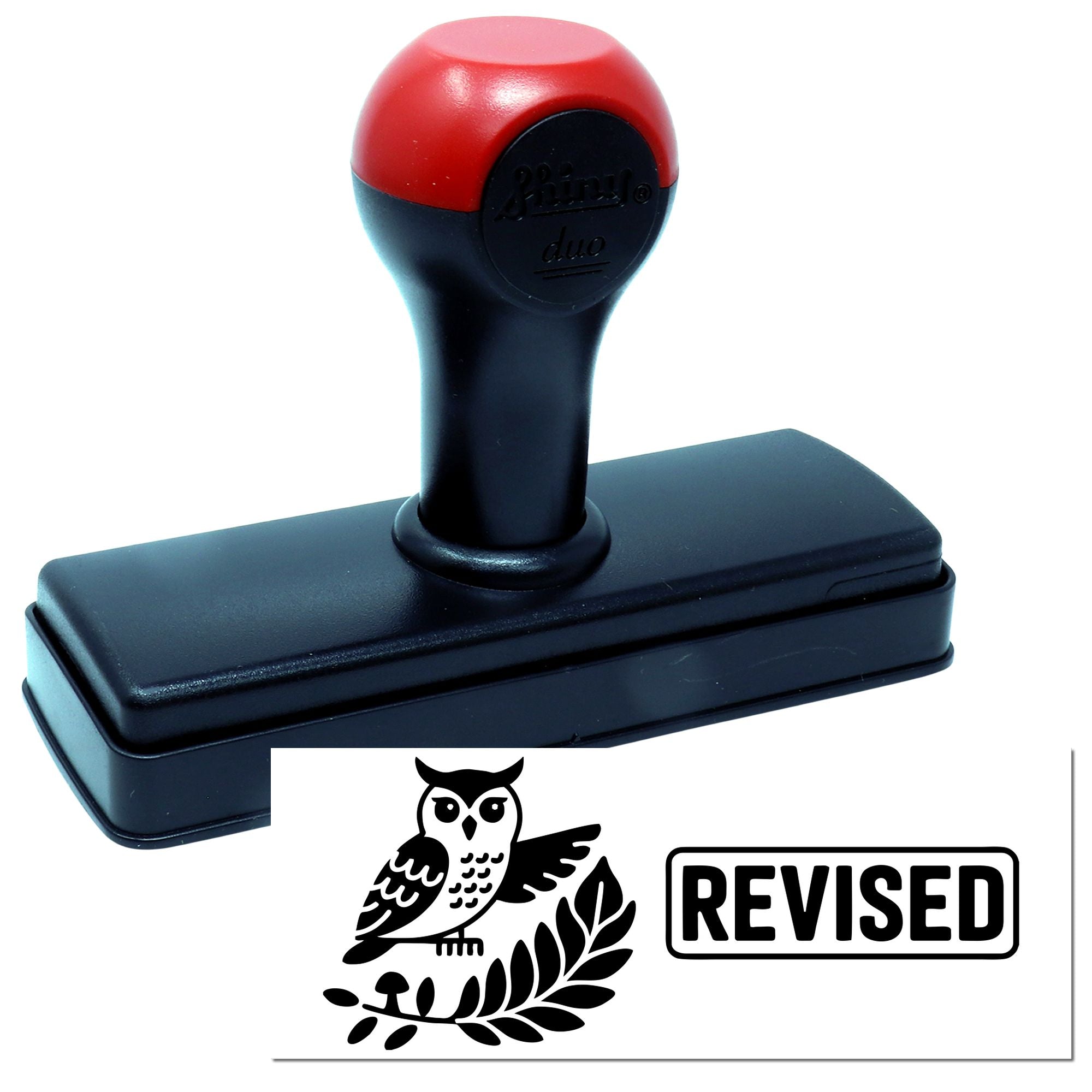 Red and black self-inking stamp with owl seal and bold REVISED imprint.