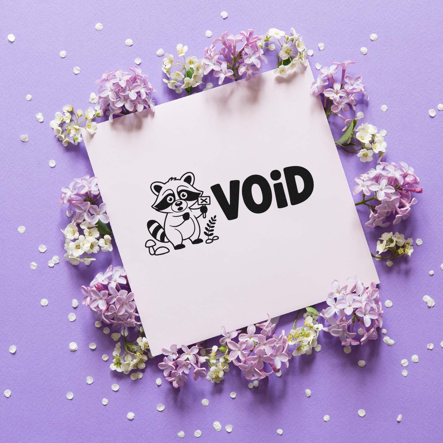 Black VOID security stamp and raccoon logo seal on pale pink card, framed by lilac flowers on a purple background.