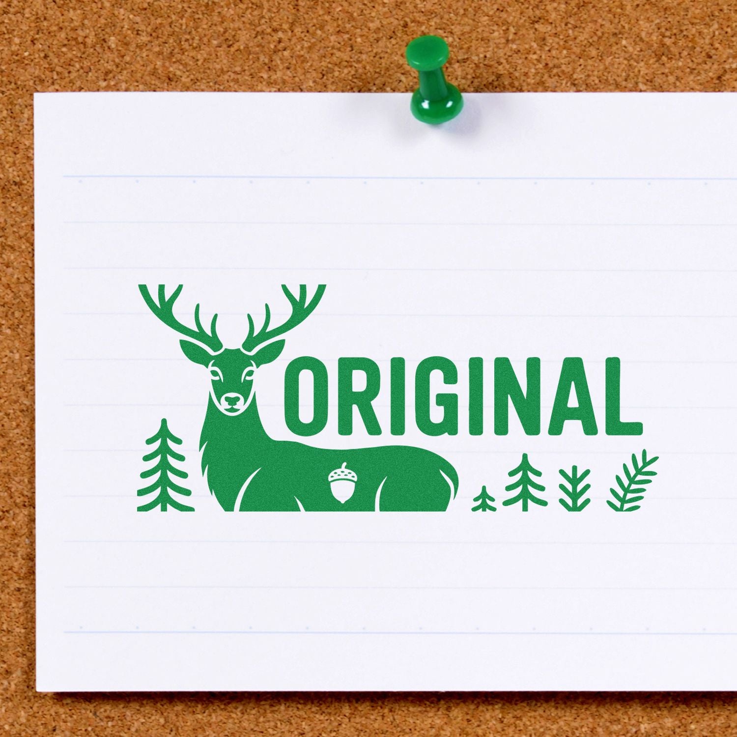 Green custom stamp seal with deer logo and ORIGINAL text on white paper, pinned to corkboard with a green pushpin.
