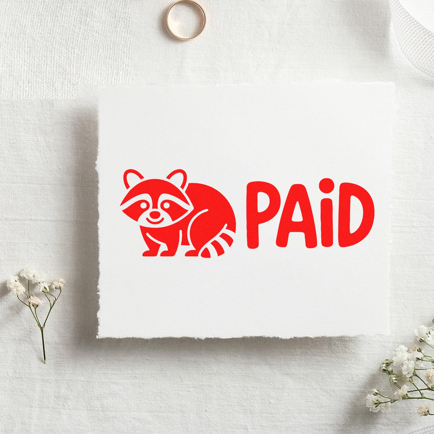 Red raccoon and PAID stamp seal on white paper, with minimalist floral accents