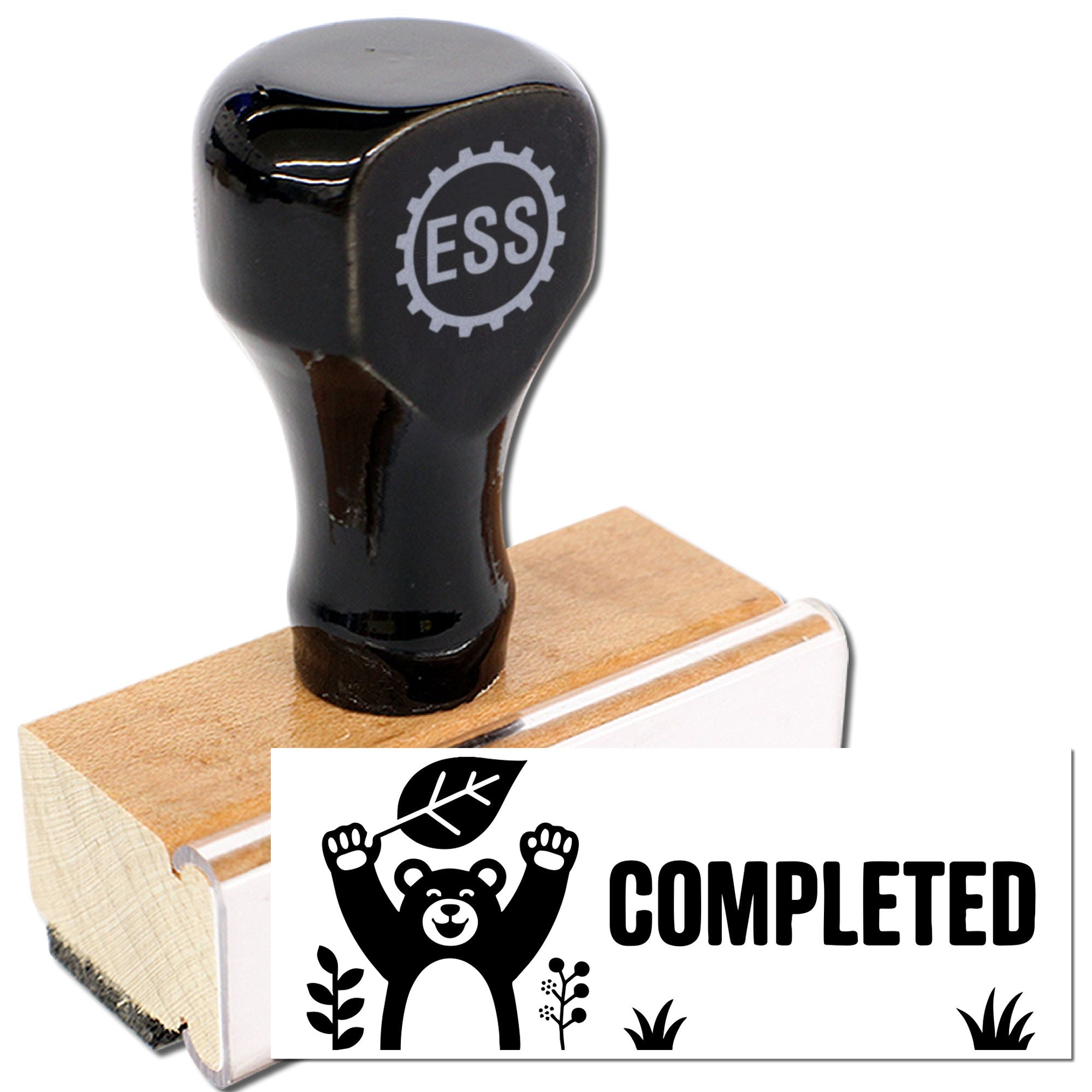 Black ESS stamp and wooden seal block with bear COMPLETED imprint on white background.