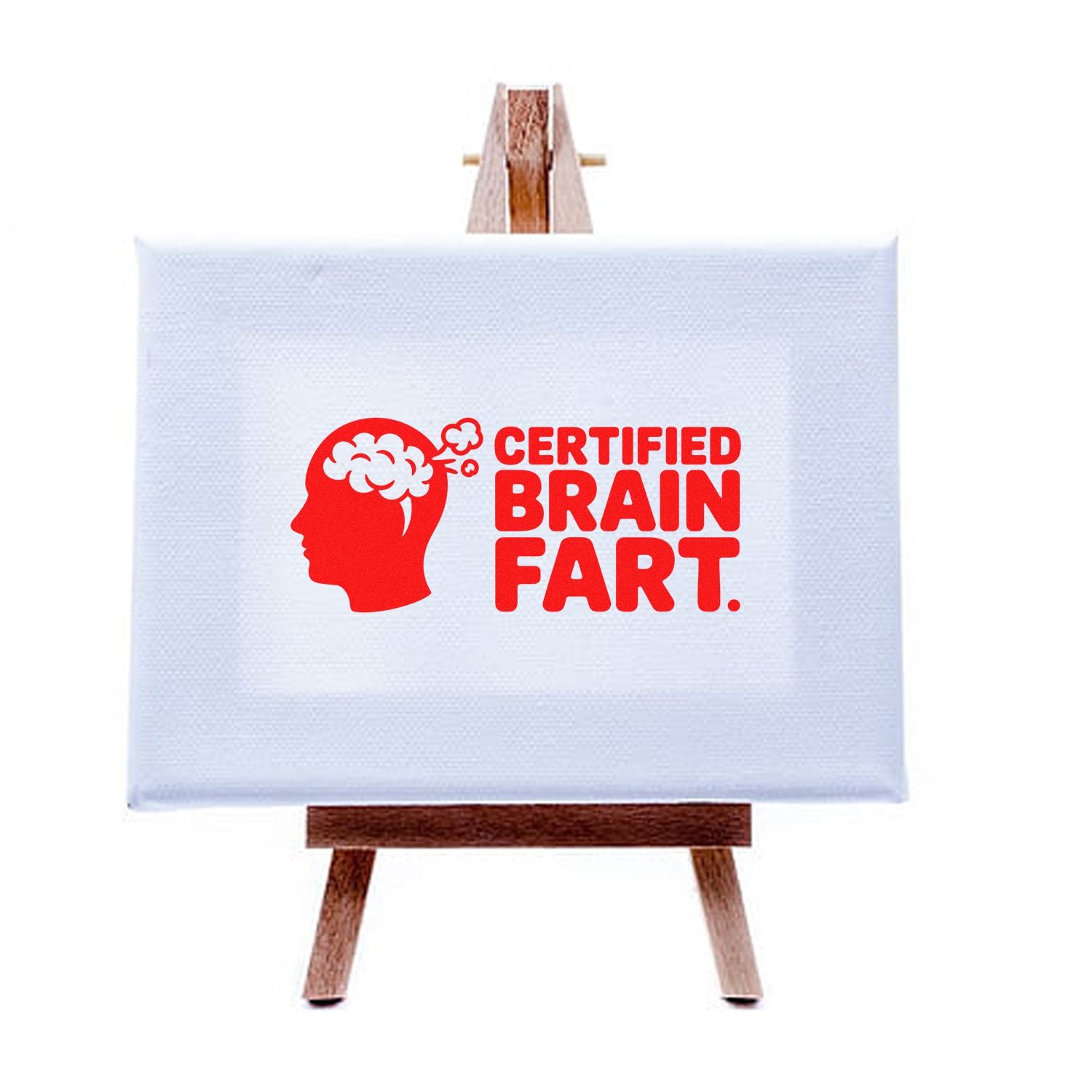 White canvas on wooden easel with red stamp-style seal reading Certified Brain Fart and brain head graphic.