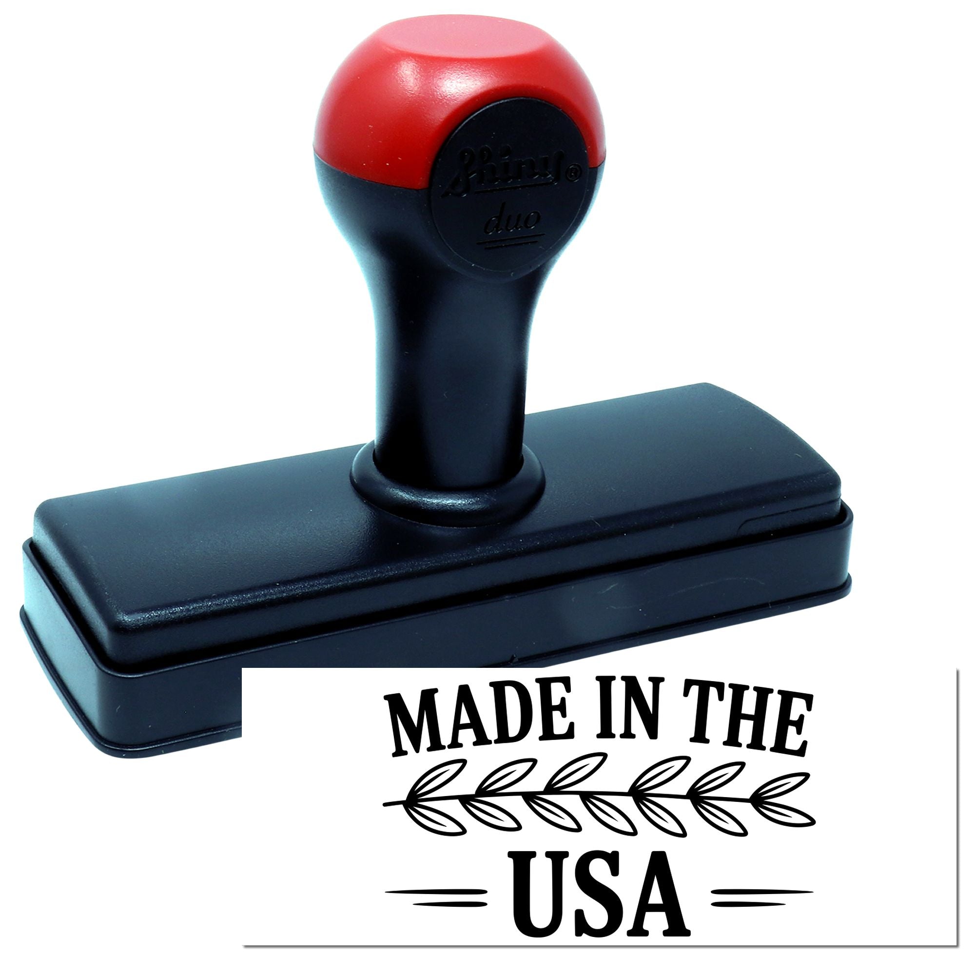 Red and black self-inking stamp with rectangular base and Made in the USA seal