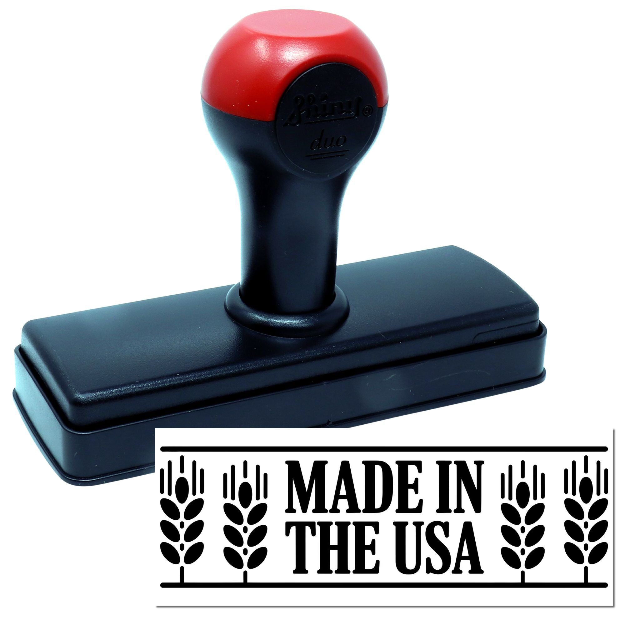 Red and black self-inking stamp with rectangular seal reading Made in the USA on a white background