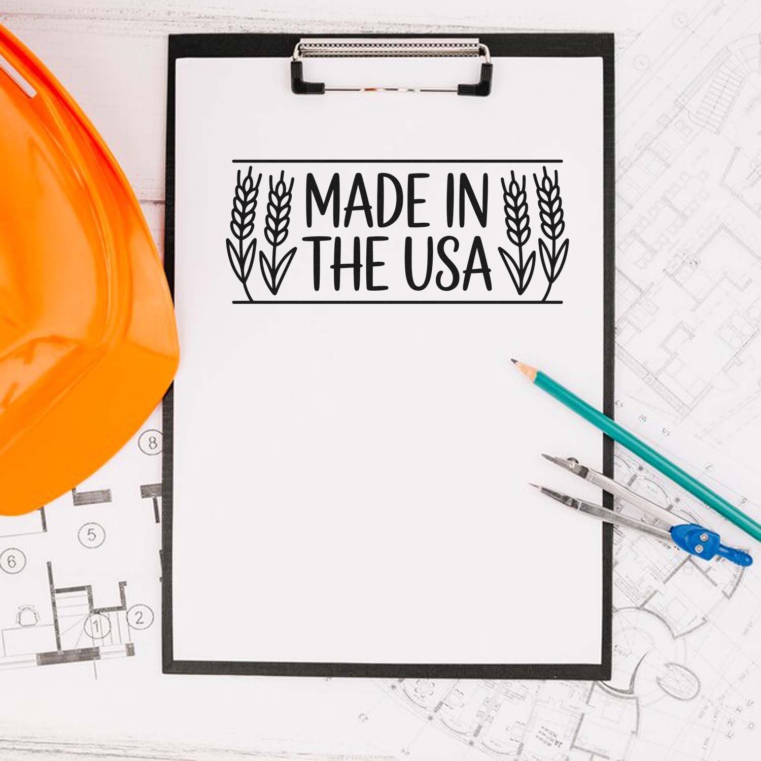 Made in the USA stamp on clipboard with orange hard hat, teal pencil, compass, and blueprints.
