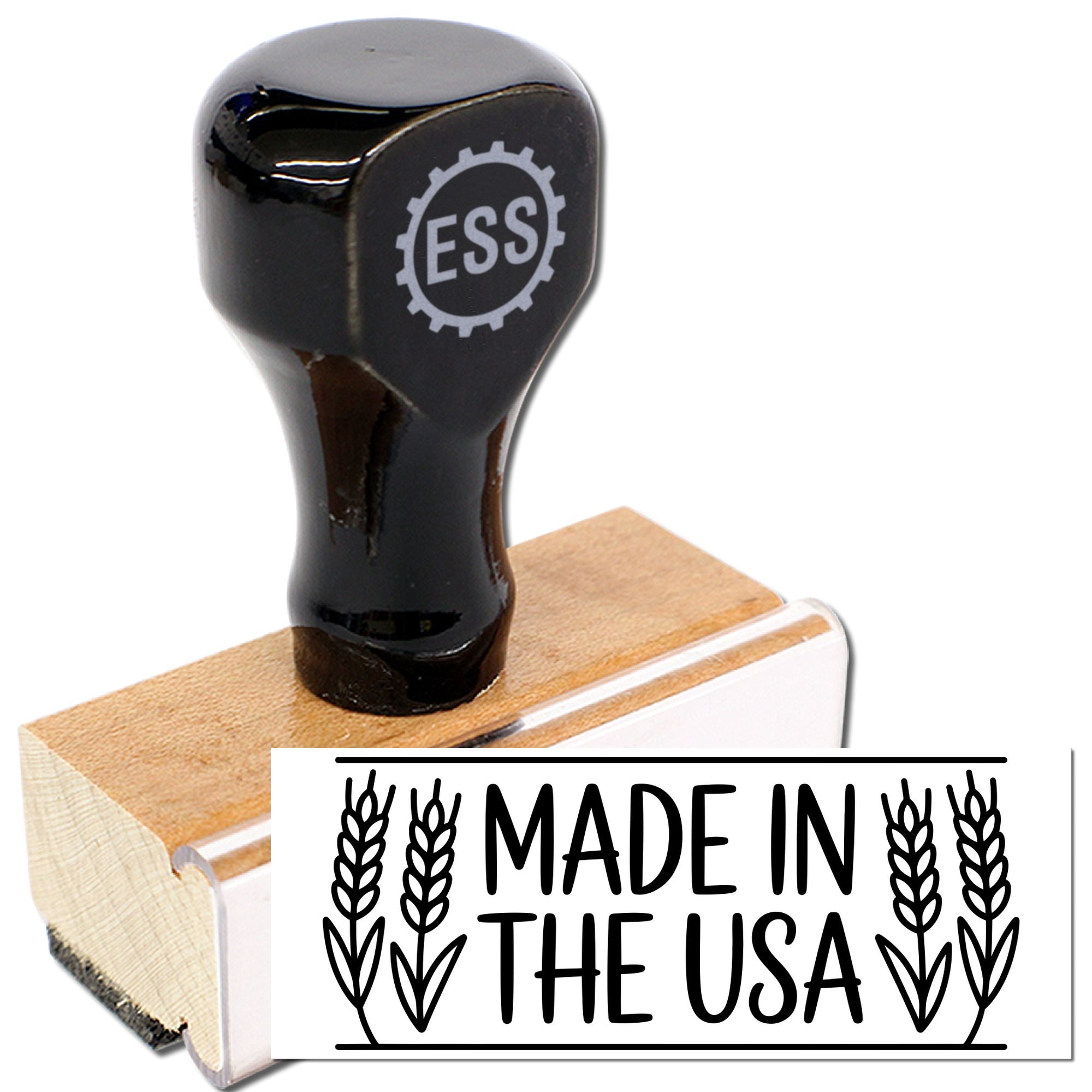 Black rubber stamp seal on a wooden block with ESS logo, showing a bold Made in the USA imprint in black.