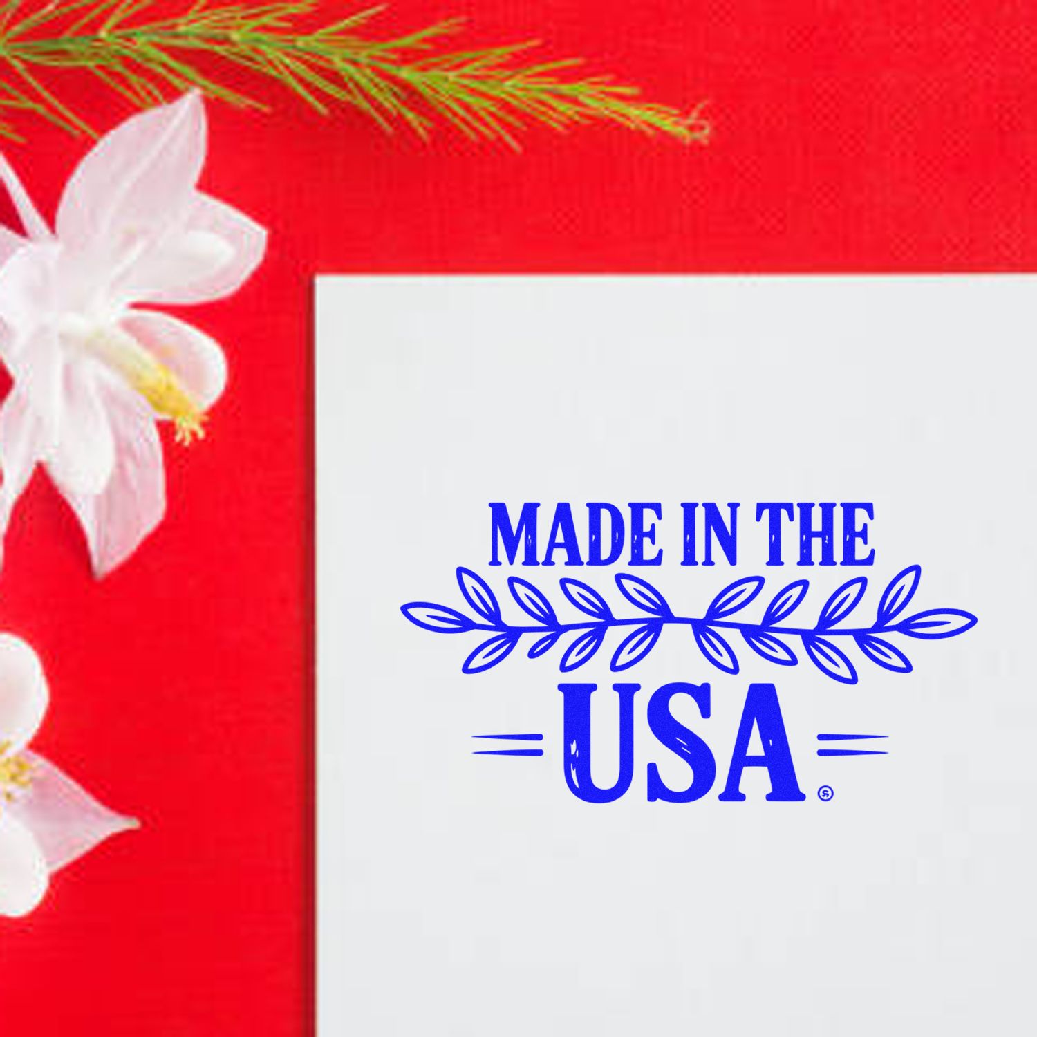 Blue Made in the USA stamp and seal on white card, with red background and white flowers.