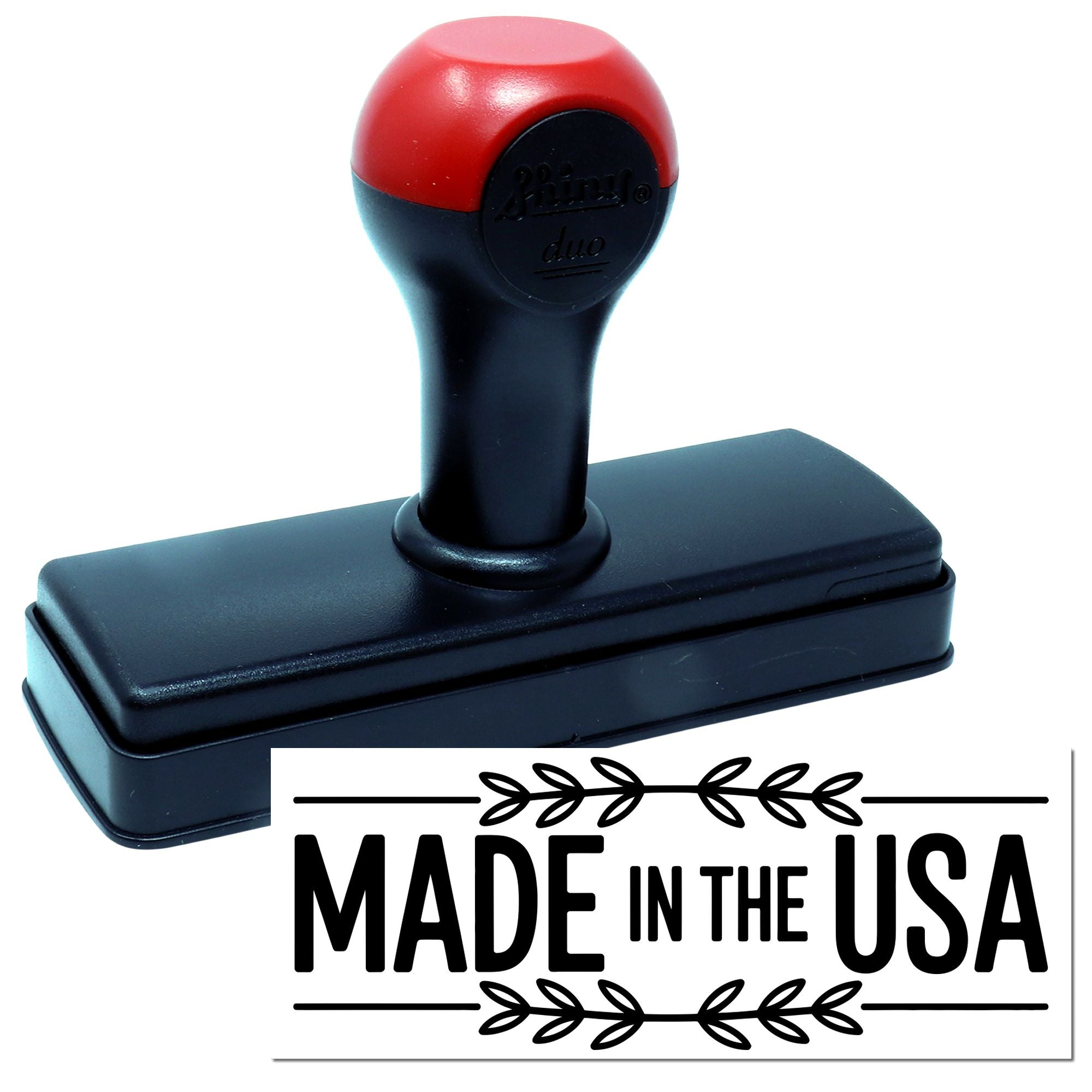 Red and black self-inking stamp with rectangular base, plus a Made in the USA seal graphic.