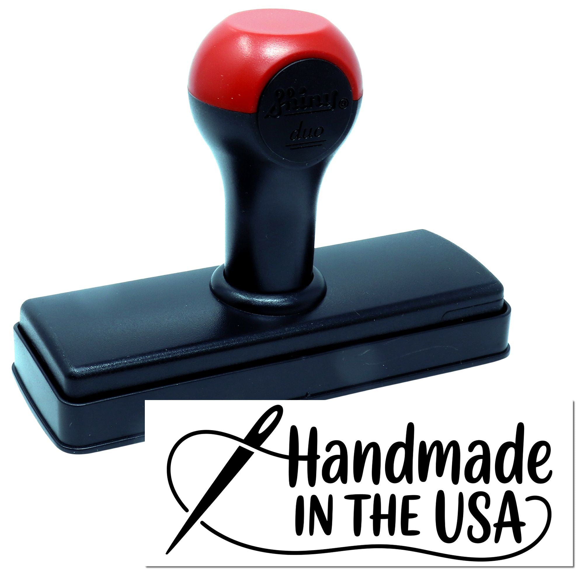 Black and red self-inking stamp seal with rectangular base and Handmade in the USA imprint.