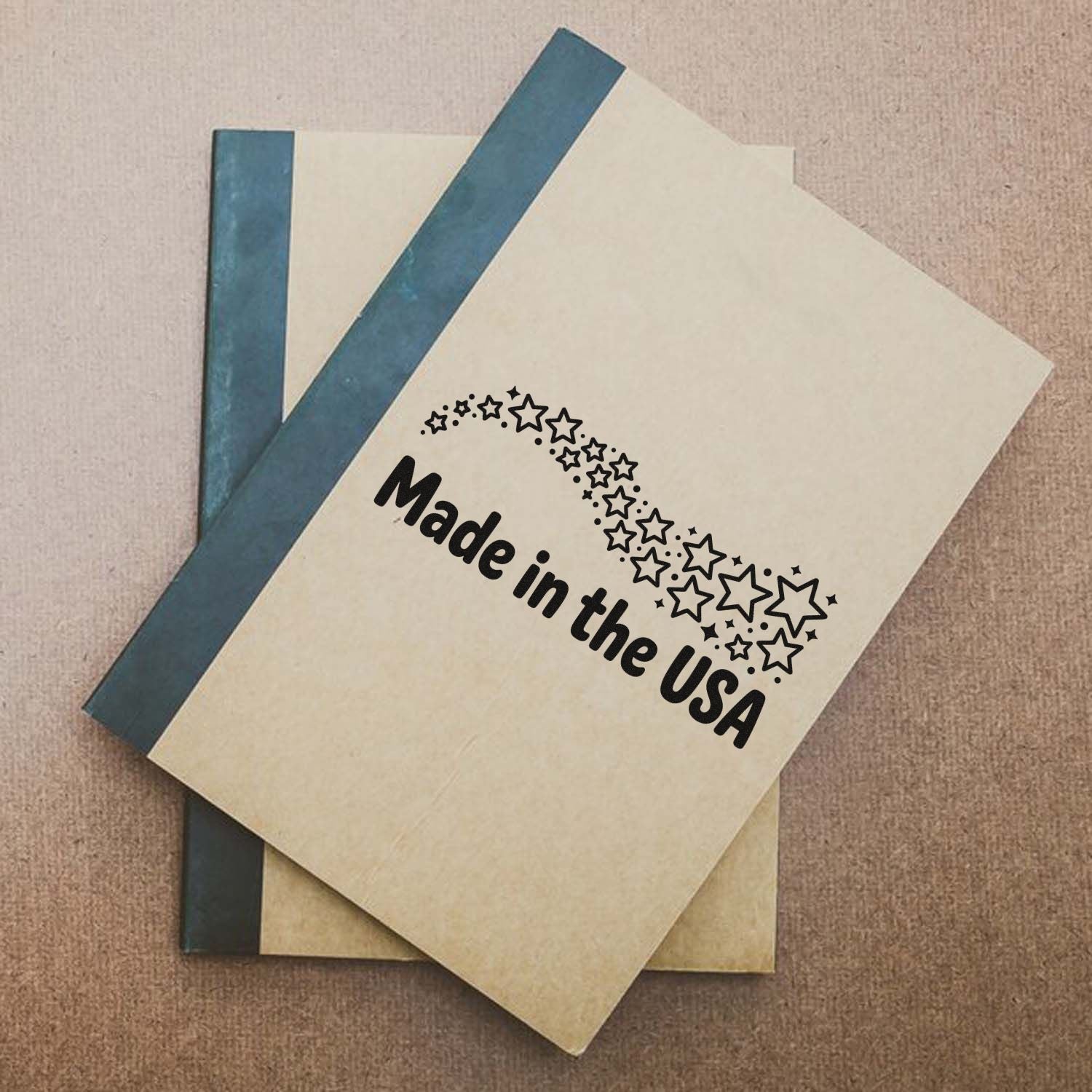 Stacked cream stamp and seal booklets with blue spines, printed black Made in the USA and stars.