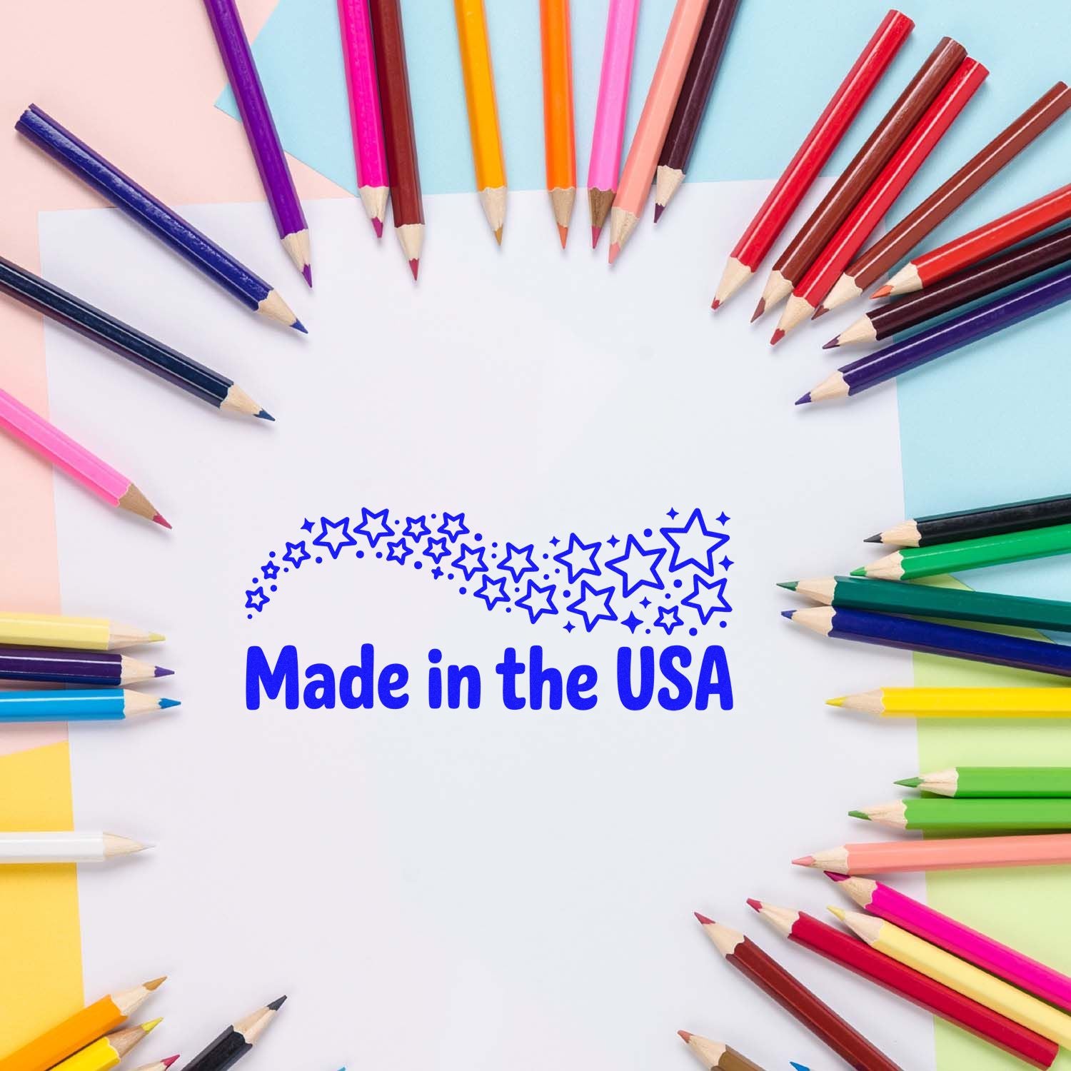 Blue Made in the USA star seal on white paper, framed by colorful pencils on a pastel pink, blue, and yellow background.