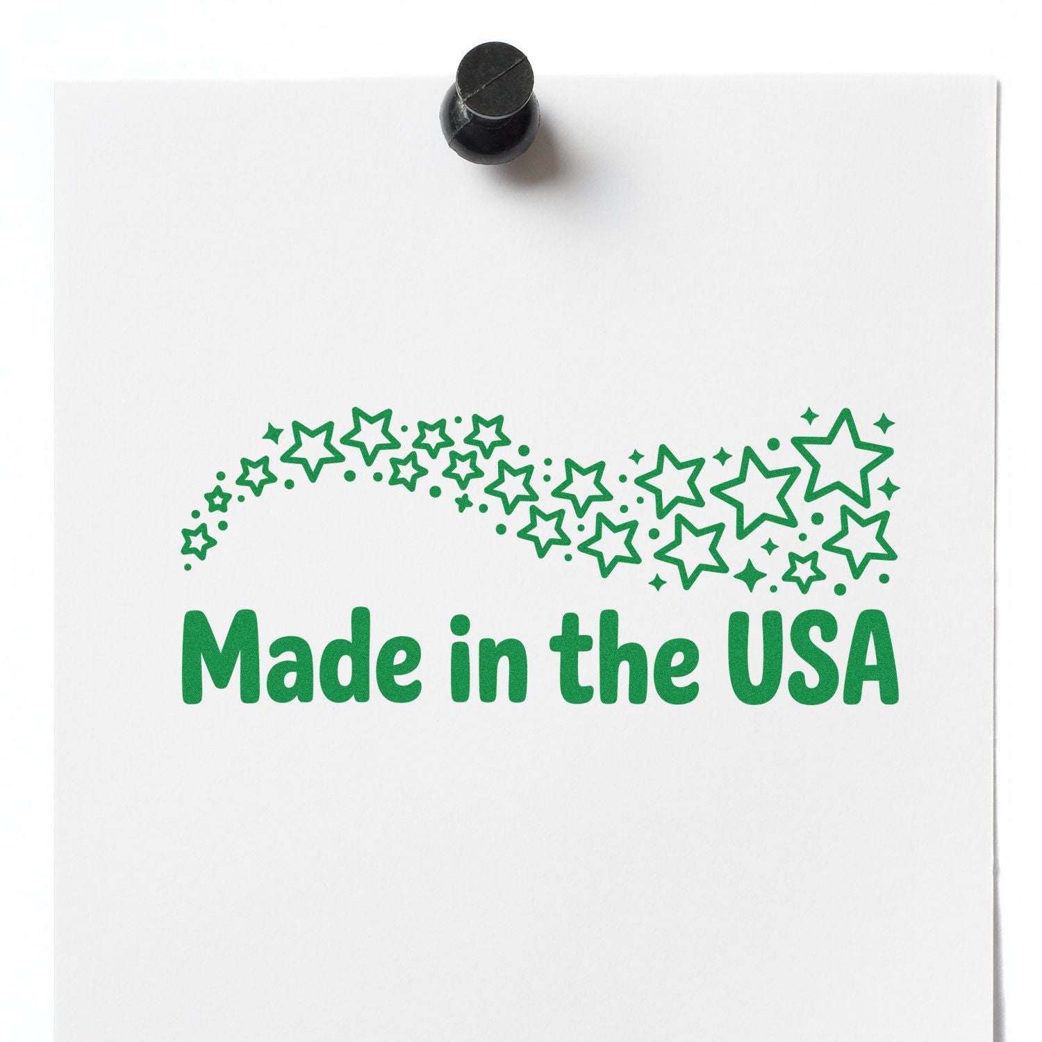 Green Made in the USA stamp with stars on white paper, topped by a black seal-style stamper.