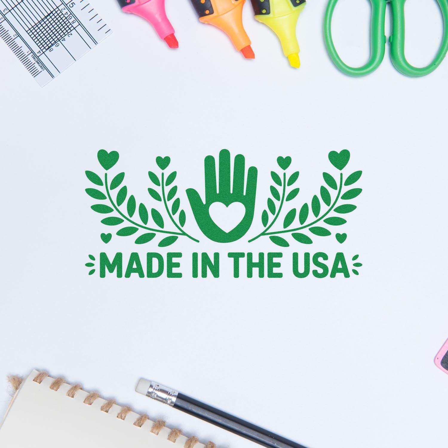 Green Made in the USA stamp seal with hand-and-leaf design on white, surrounded by colorful craft tools.