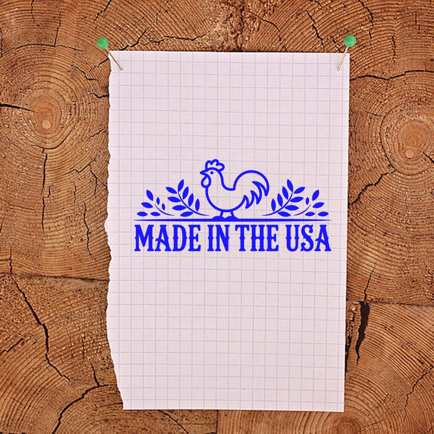 Blue Made in the USA rooster stamp and seal on graph paper, pinned over a rustic wood background.
