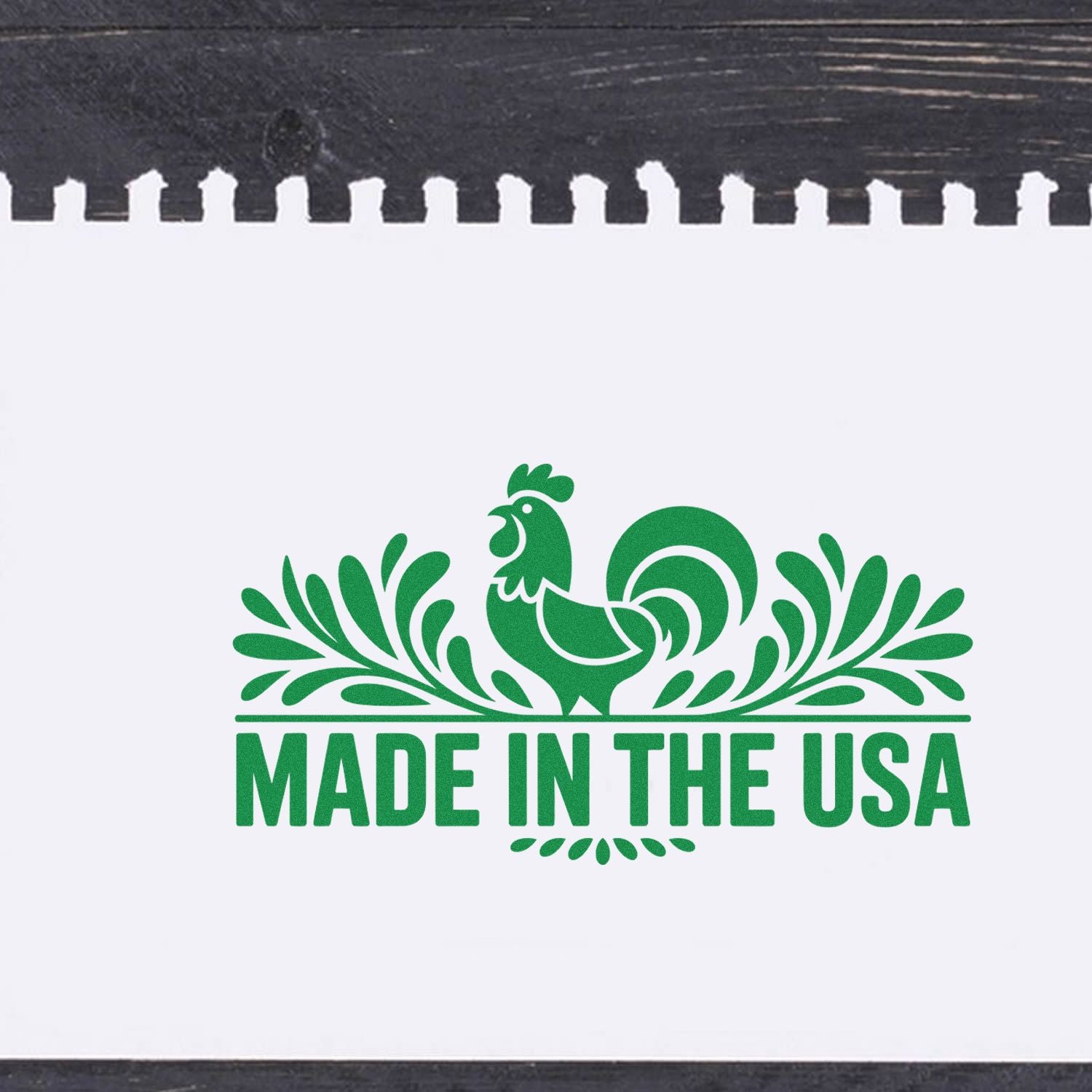 Green Made in the USA rubber stamp seal with rooster and decorative flourishes on white background.