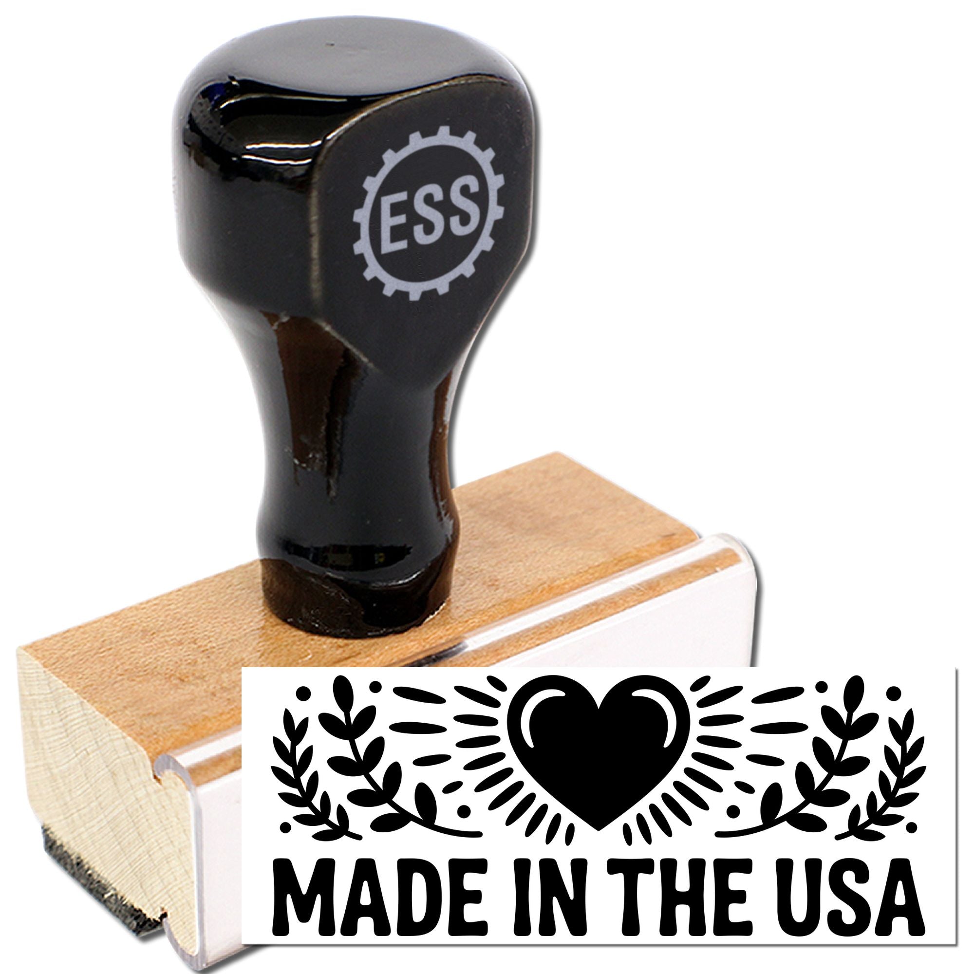 Black ESS rubber stamp on wooden block with white Made in the USA seal and heart graphic.