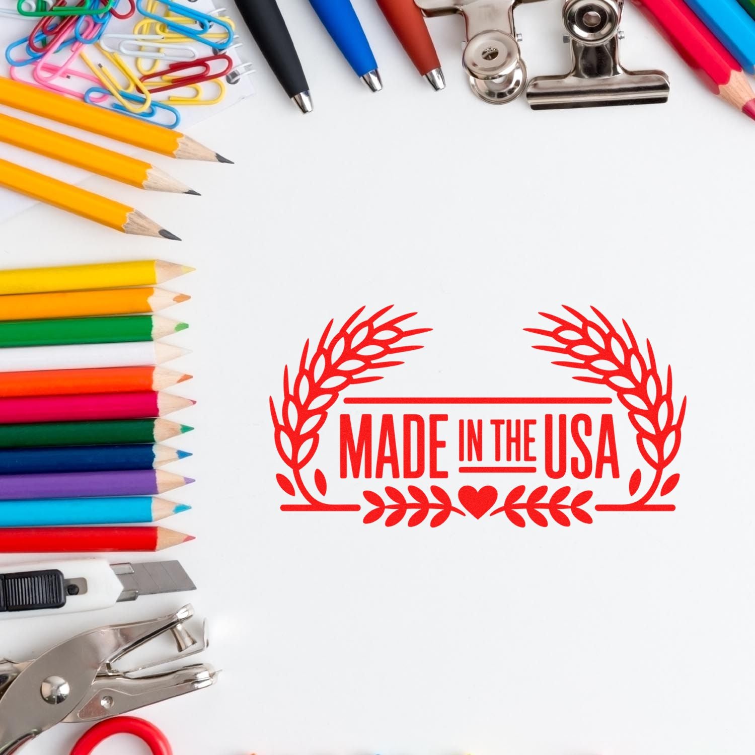 Red Made in USA stamp seal surrounded by colorful pencils, pens, paper clips, and office tools