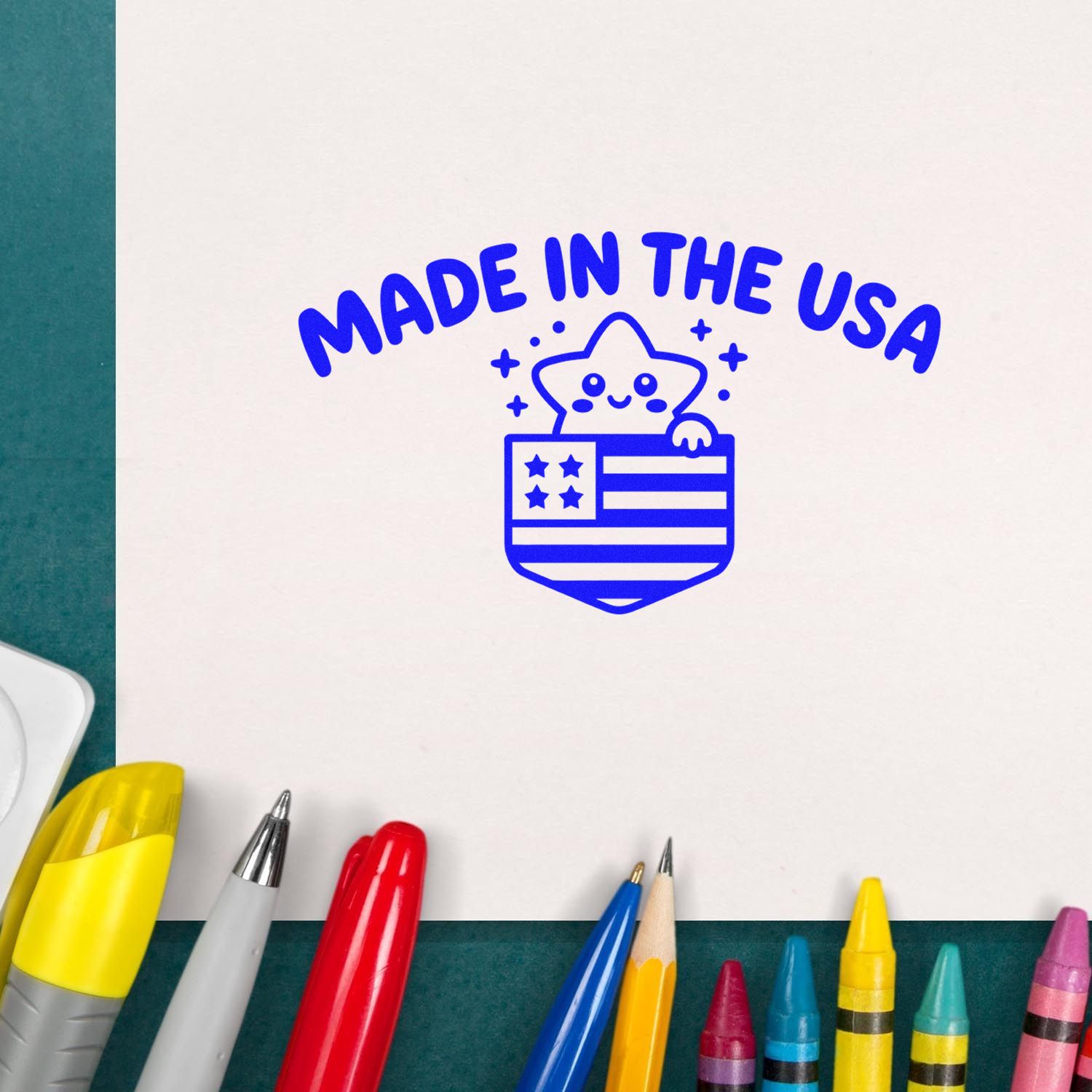 Blue Made in the USA stamp seal with star mascot on white paper, surrounded by colorful markers.
