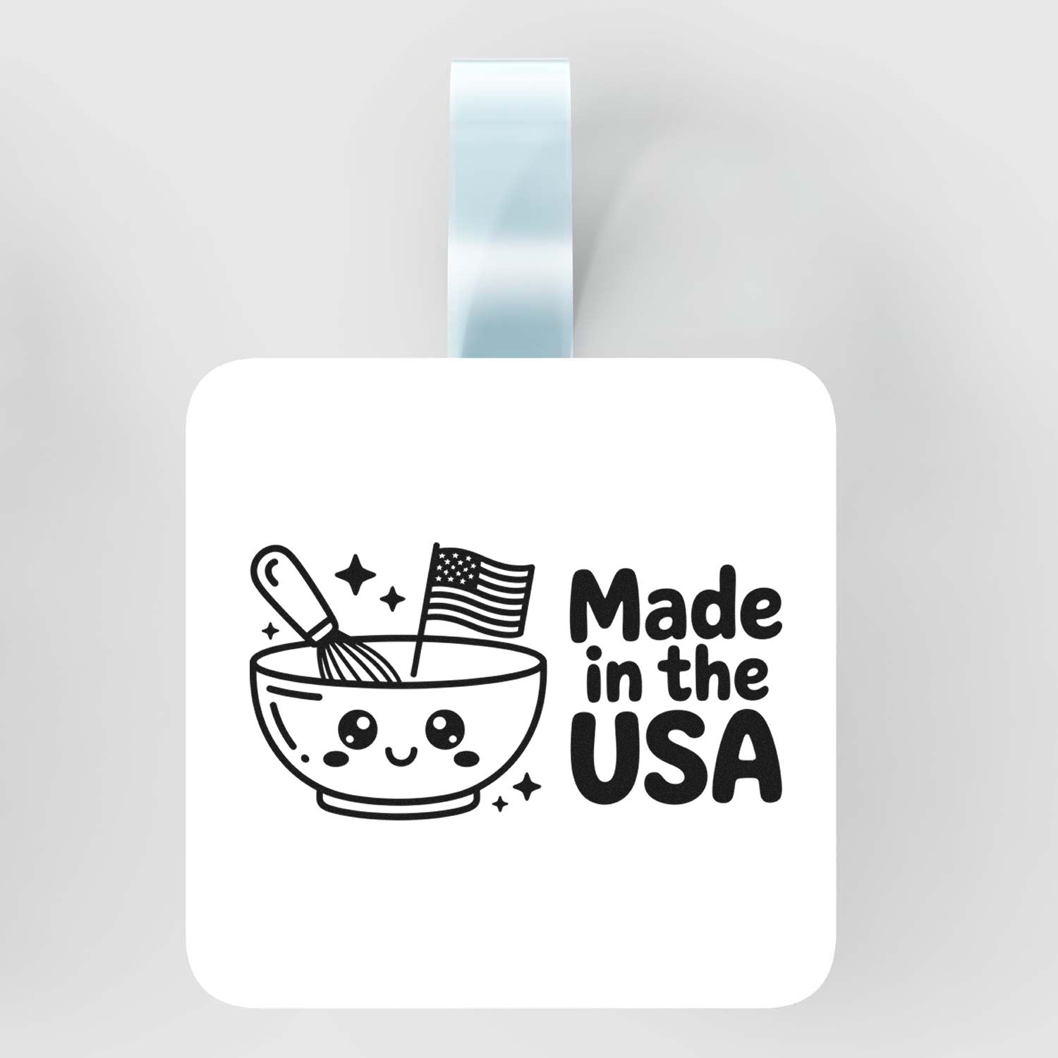 White self-inking stamp seal with cute bowl and U.S. flag graphic, bold black Made in the USA text, blue handle.