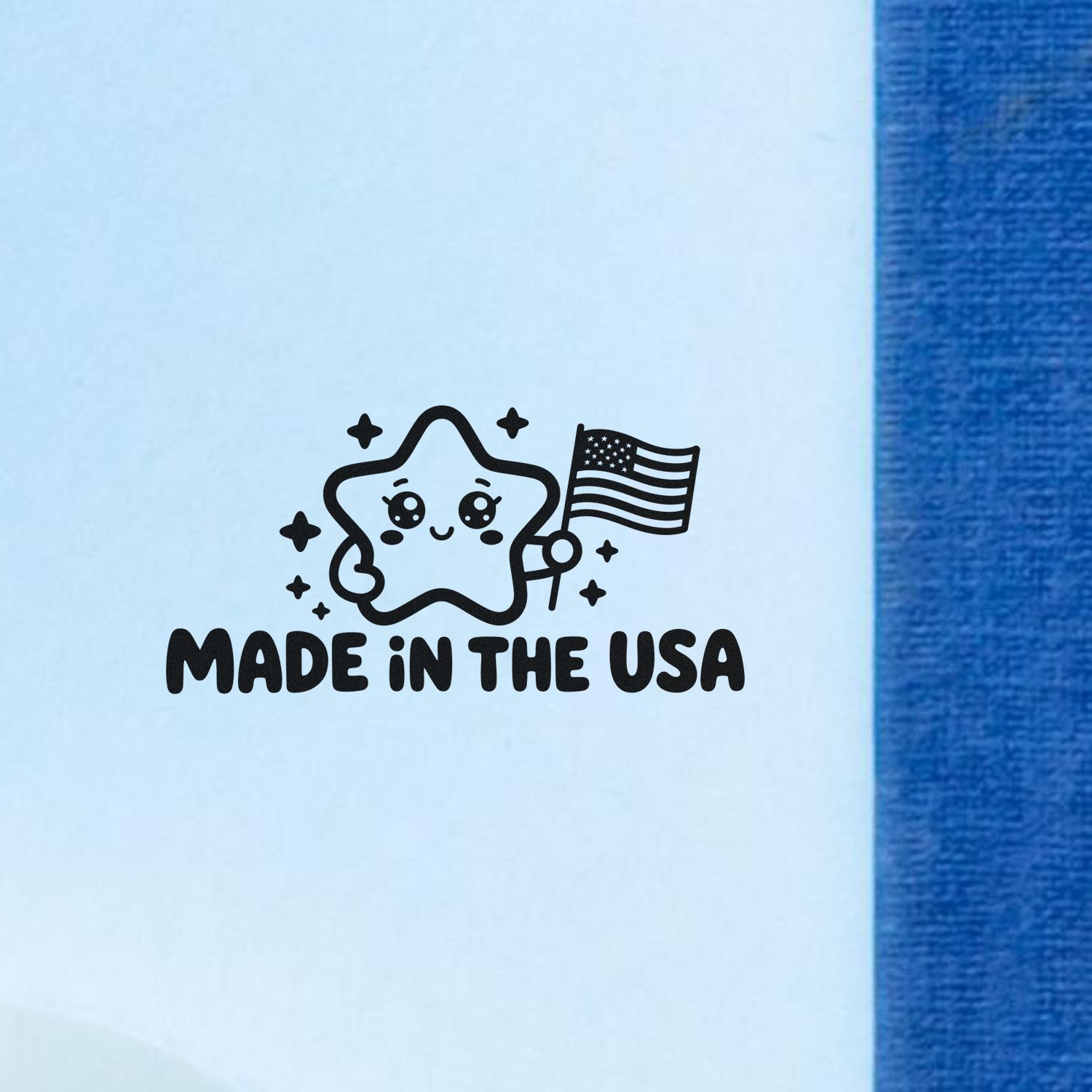Black Made in the USA stamp seal with a cute star holding an American flag on light blue, beside a blue strip.