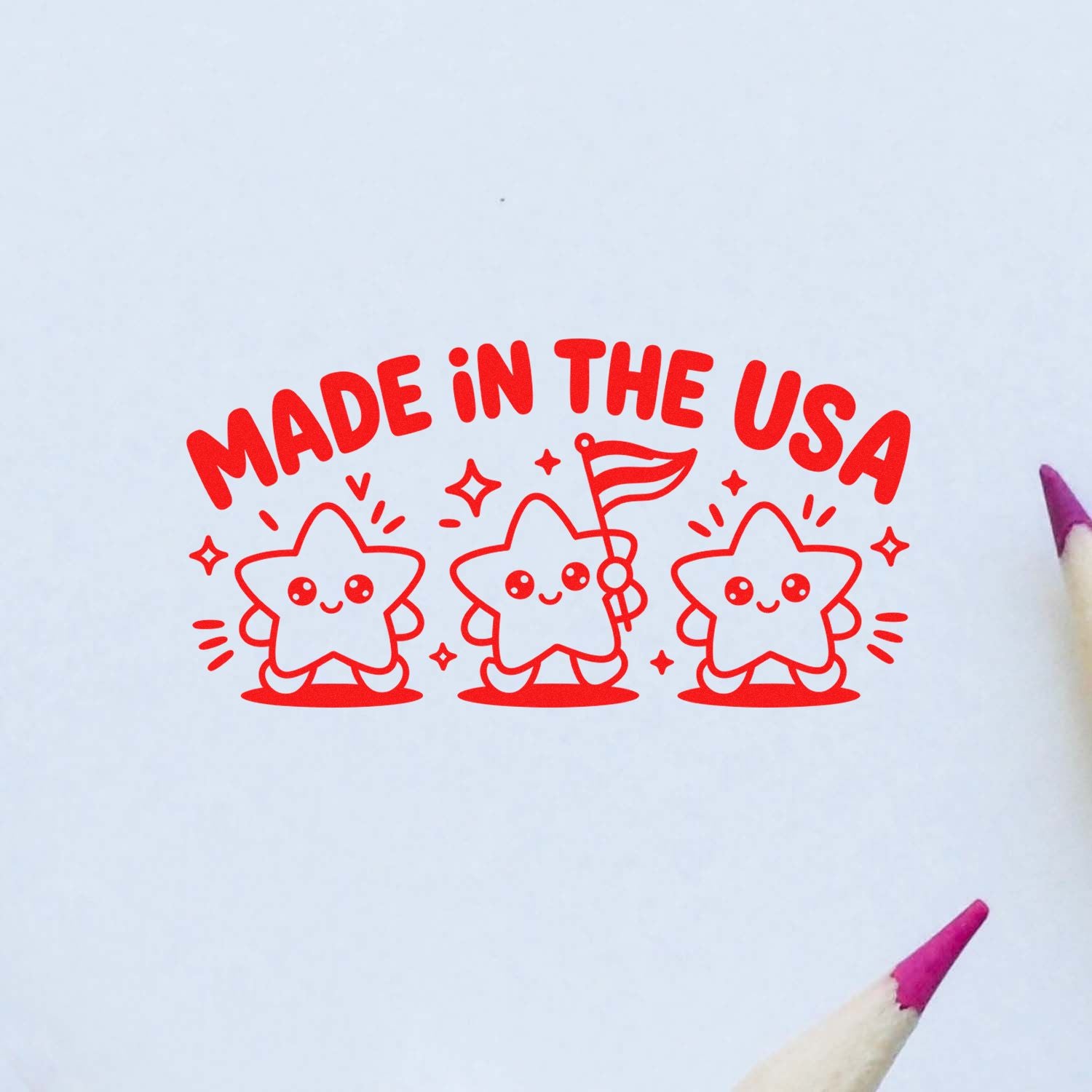 Red Made in the USA stamp seal with three smiling star characters on white paper.