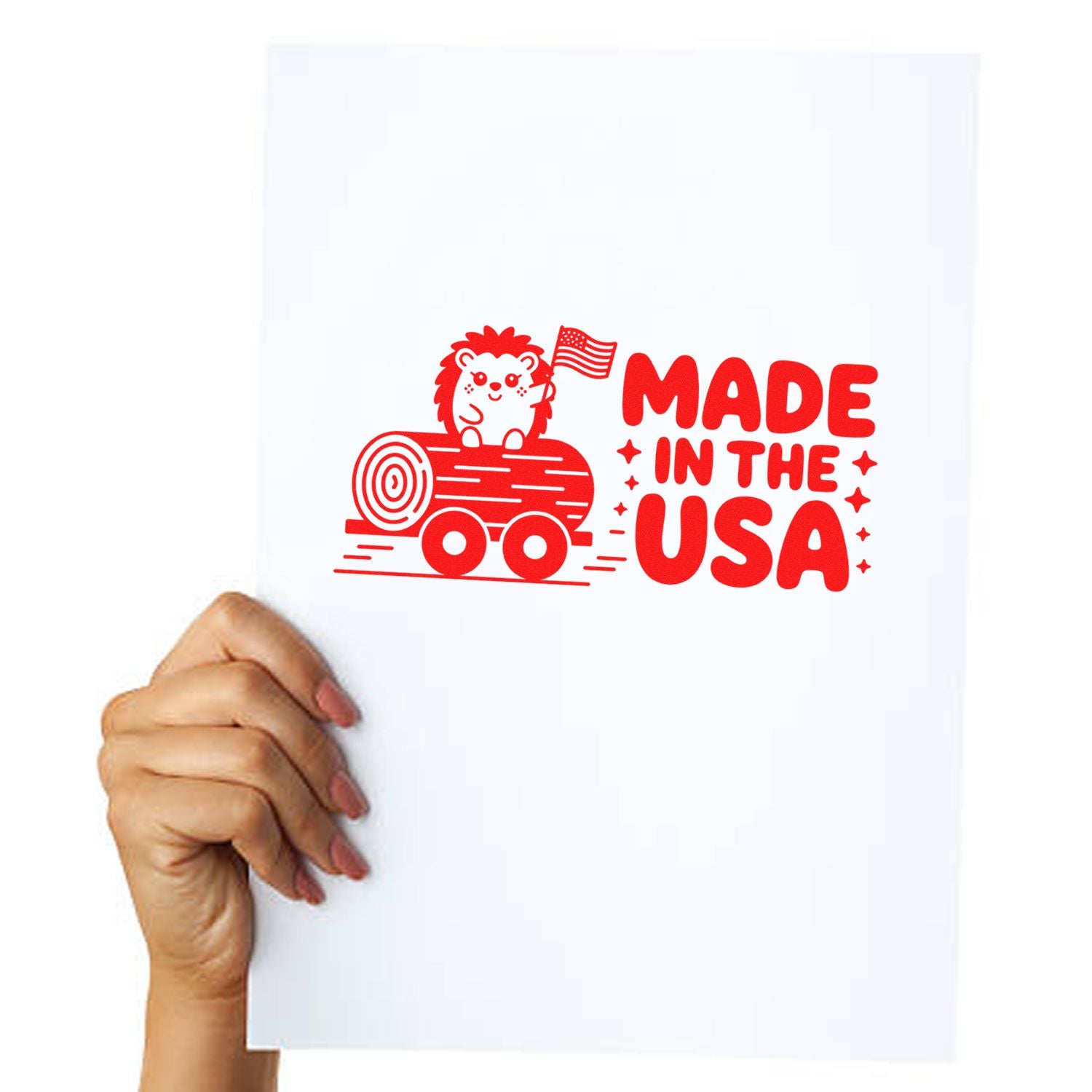 Red Made in the USA stamp seal with hedgehog on log and American flag on a white sheet held by a hand