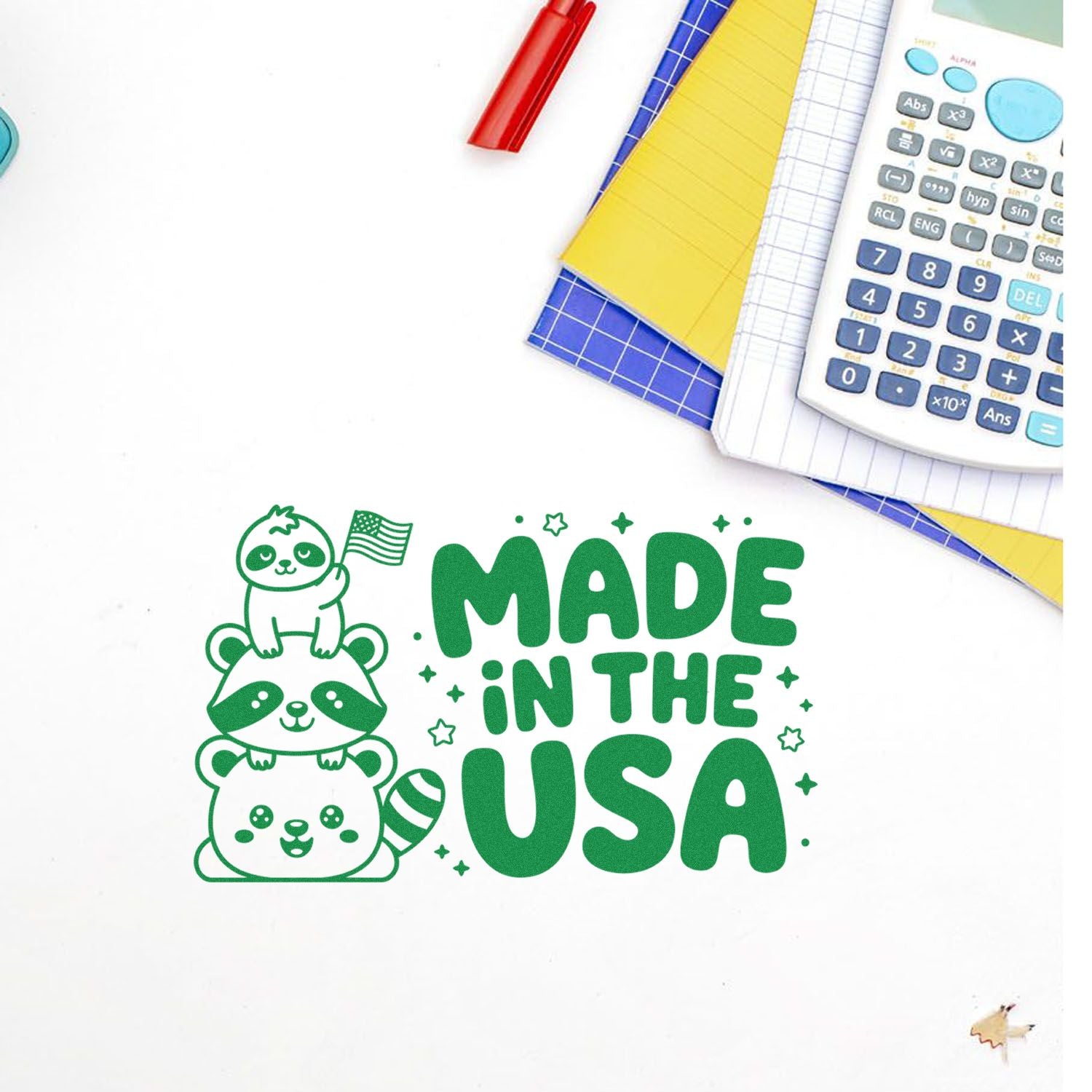 Green stamp and seal reading Made in the USA with stacked cartoon raccoons and stars, beside notebooks and a calculator.