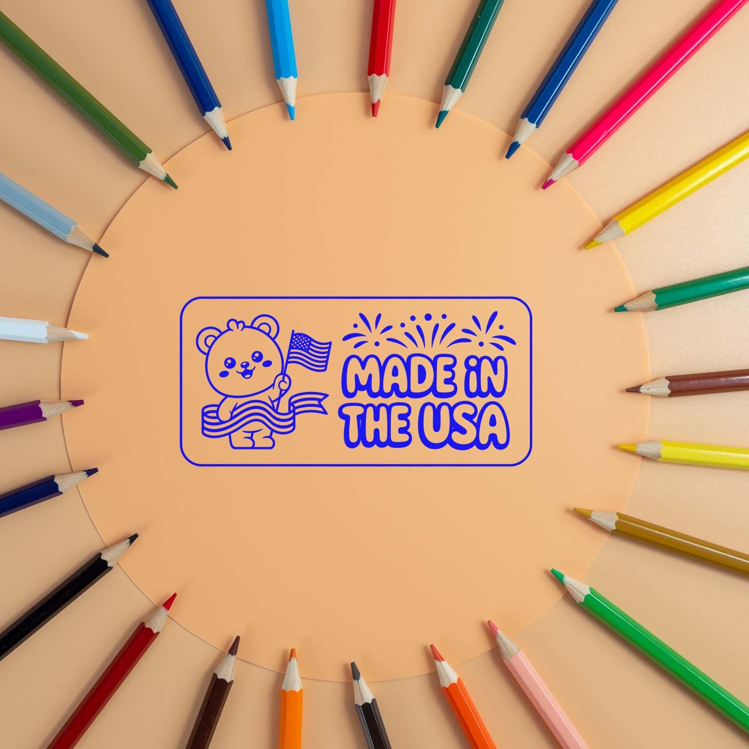 Blue Made in the USA stamp seal with bear and flag, centered on peach background, framed by rainbow-colored pencils.