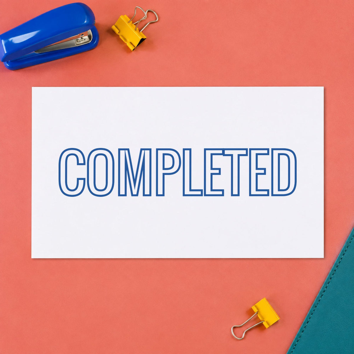 "Completed" stamp pressed on paper, no separate ink pad needed