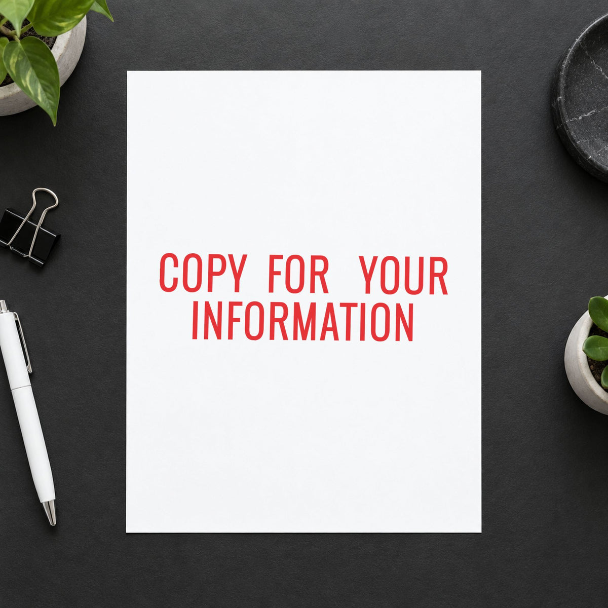 Pre-inked "Copy for your information" stamp marking paperwork in an office setting