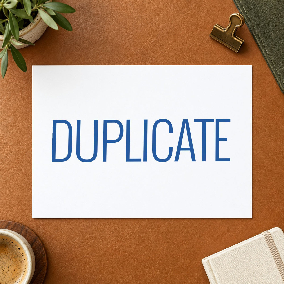 "Duplicate" stamp pressed on paper, no separate ink pad needed