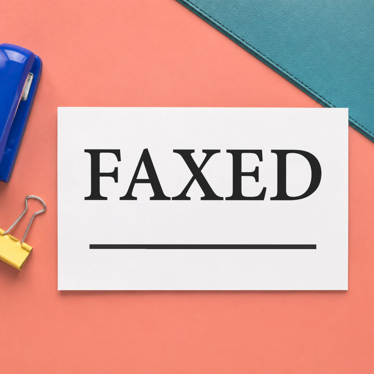 "Faxed" Xstamper stamp in use on paper, Approximately 1/2 in tall x 1-5/8 in wide rectangle imprint