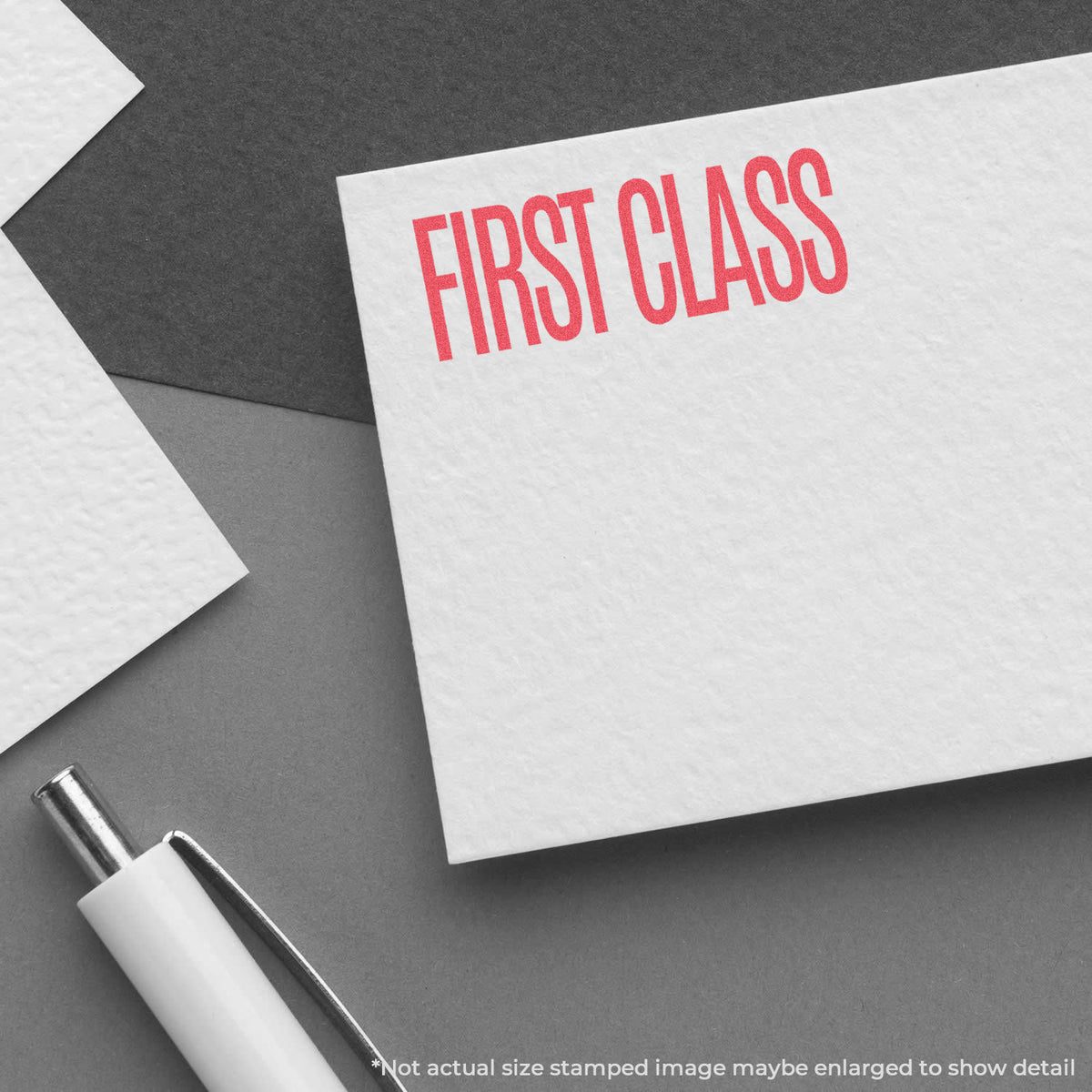 "First class" pre-inked imprint on a page, rectangle shape at Approximately 1/2 in tall x 1-5/8 in wide