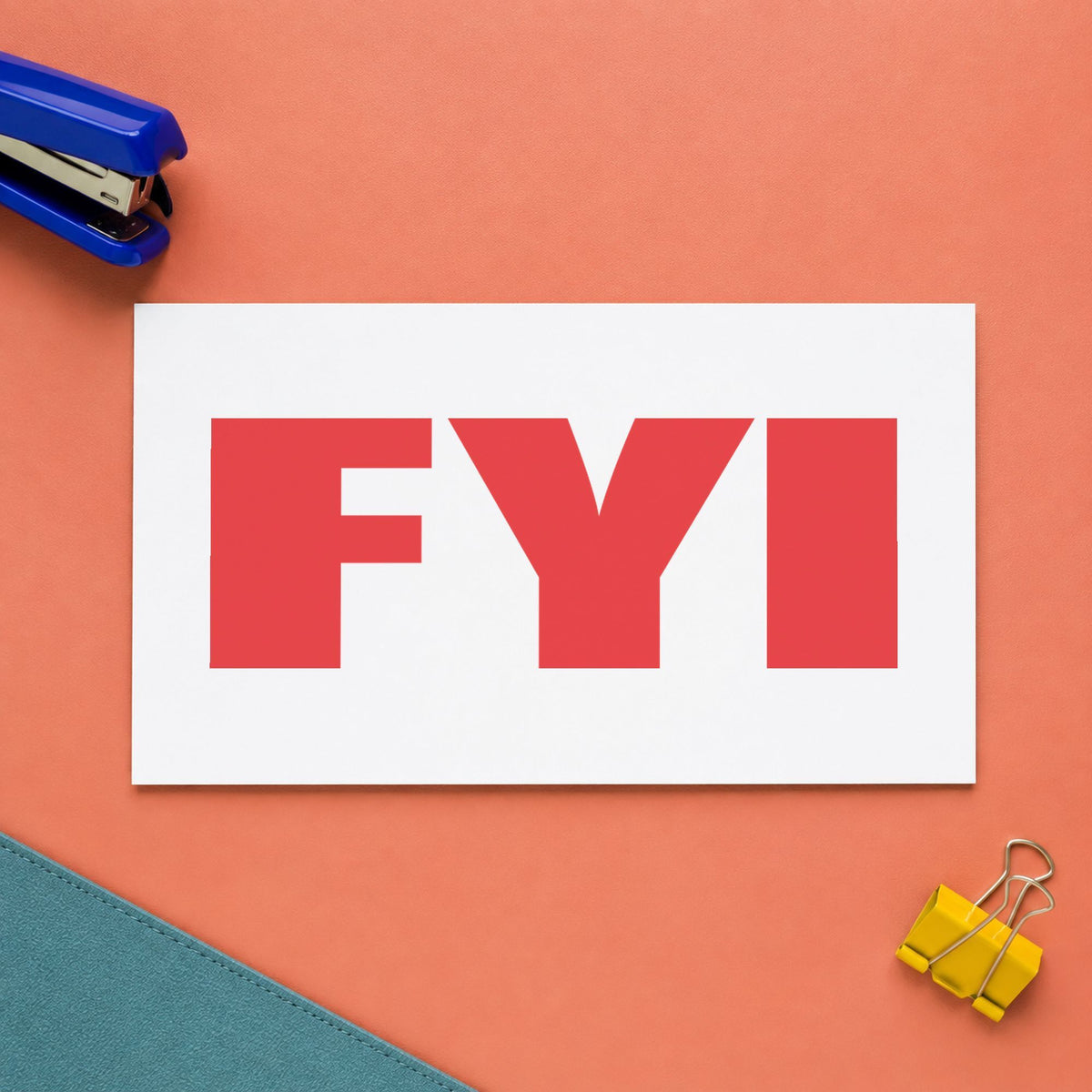 "FYI" Xstamper stamp in use on paper, 1/2 x 1-5/8 in rectangle imprint