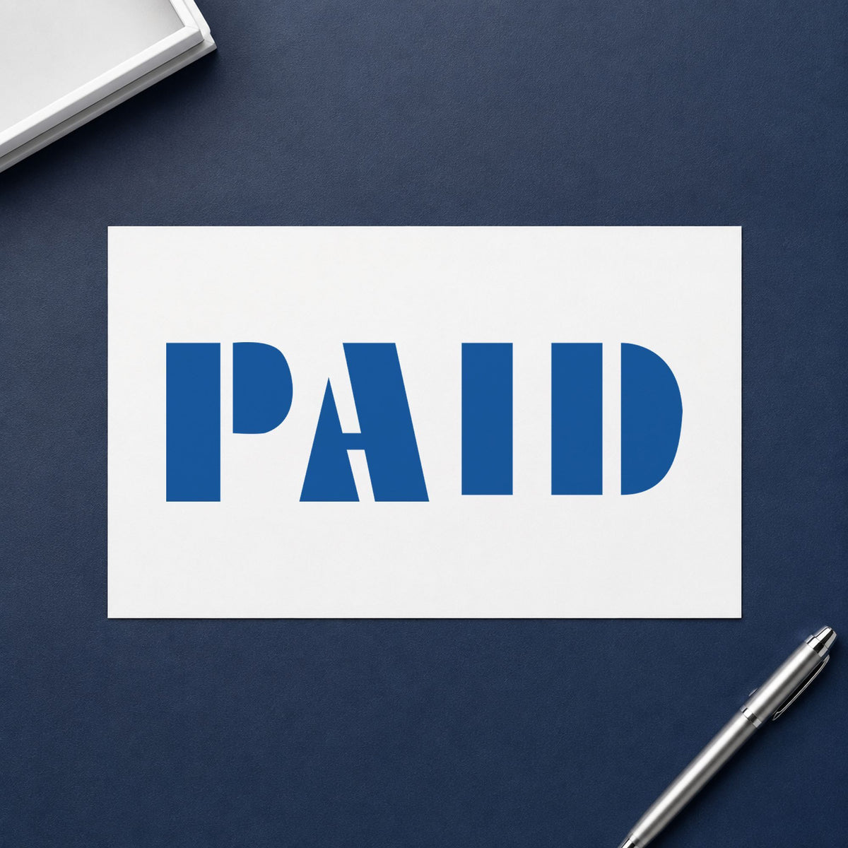 "Paid" Xstamper No. 1335 stamp shown in everyday handling