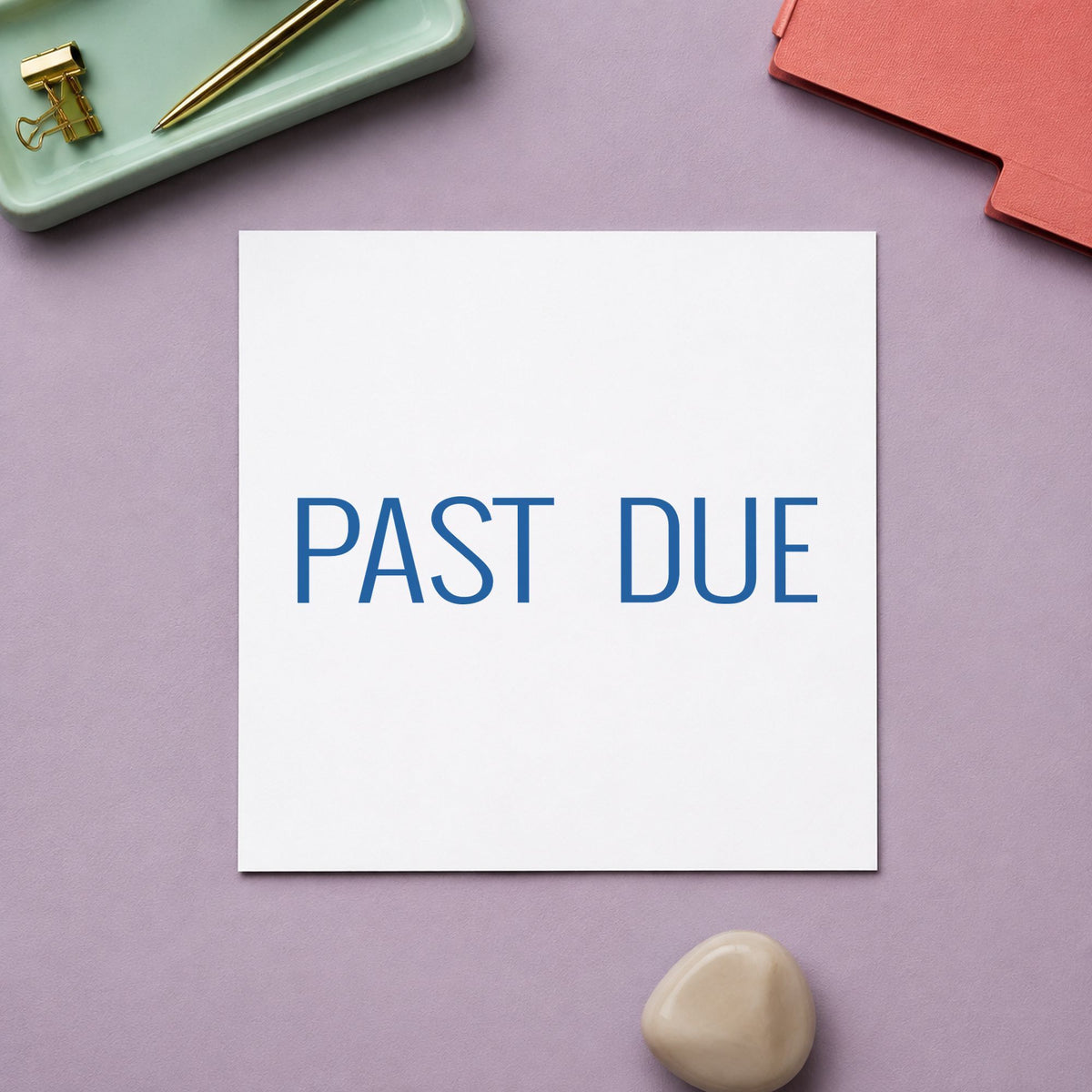 Pre-inked "Past due" stamp marking paperwork in an office setting